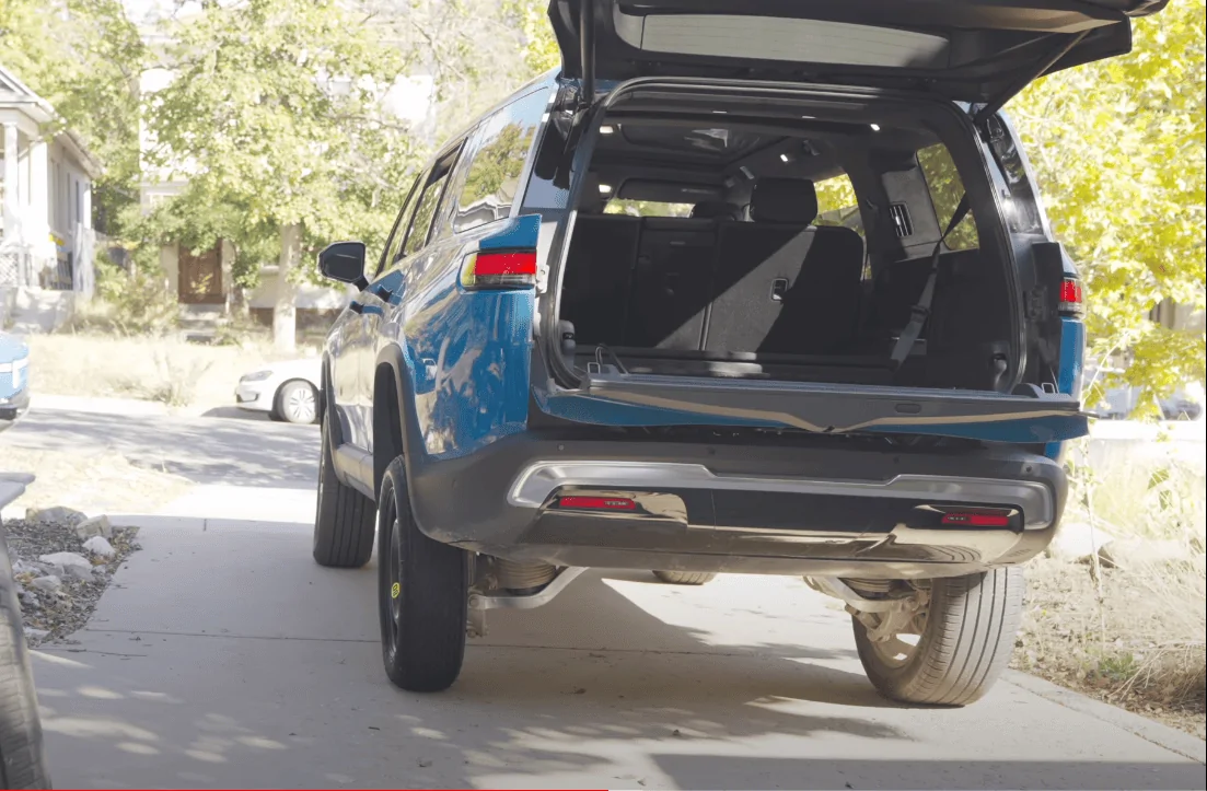 Rivian R1T R1S Rivian compact spare inflated & installed in glowing R1S review video [by Snazzy Labs] 1666367655154