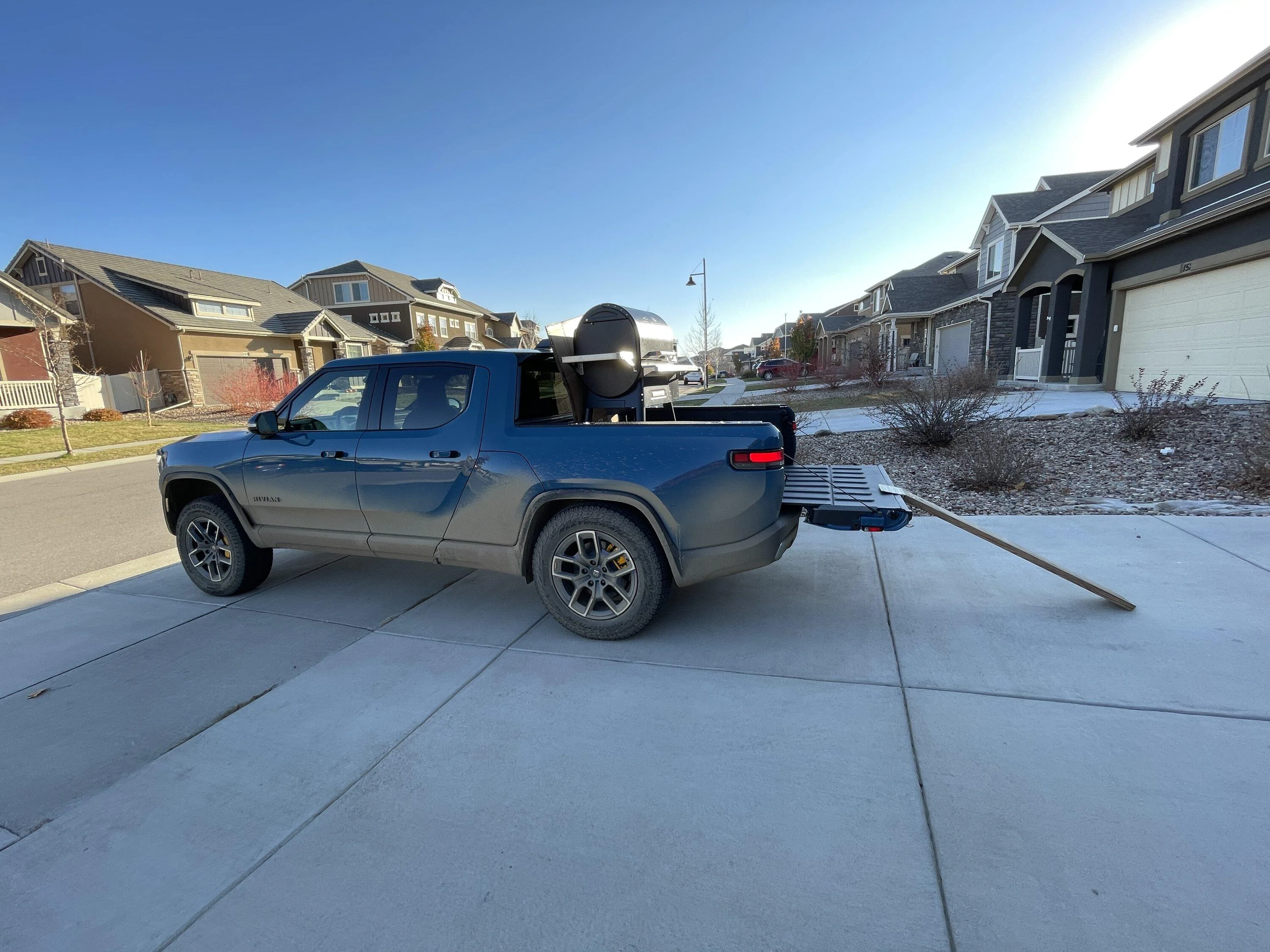 Rivian R1T R1S Unloading cargo with Camp Mode inspires Rear Tilt Mode idea 4843DFA3-1B7D-498B-B0C2-F90934922EE2
