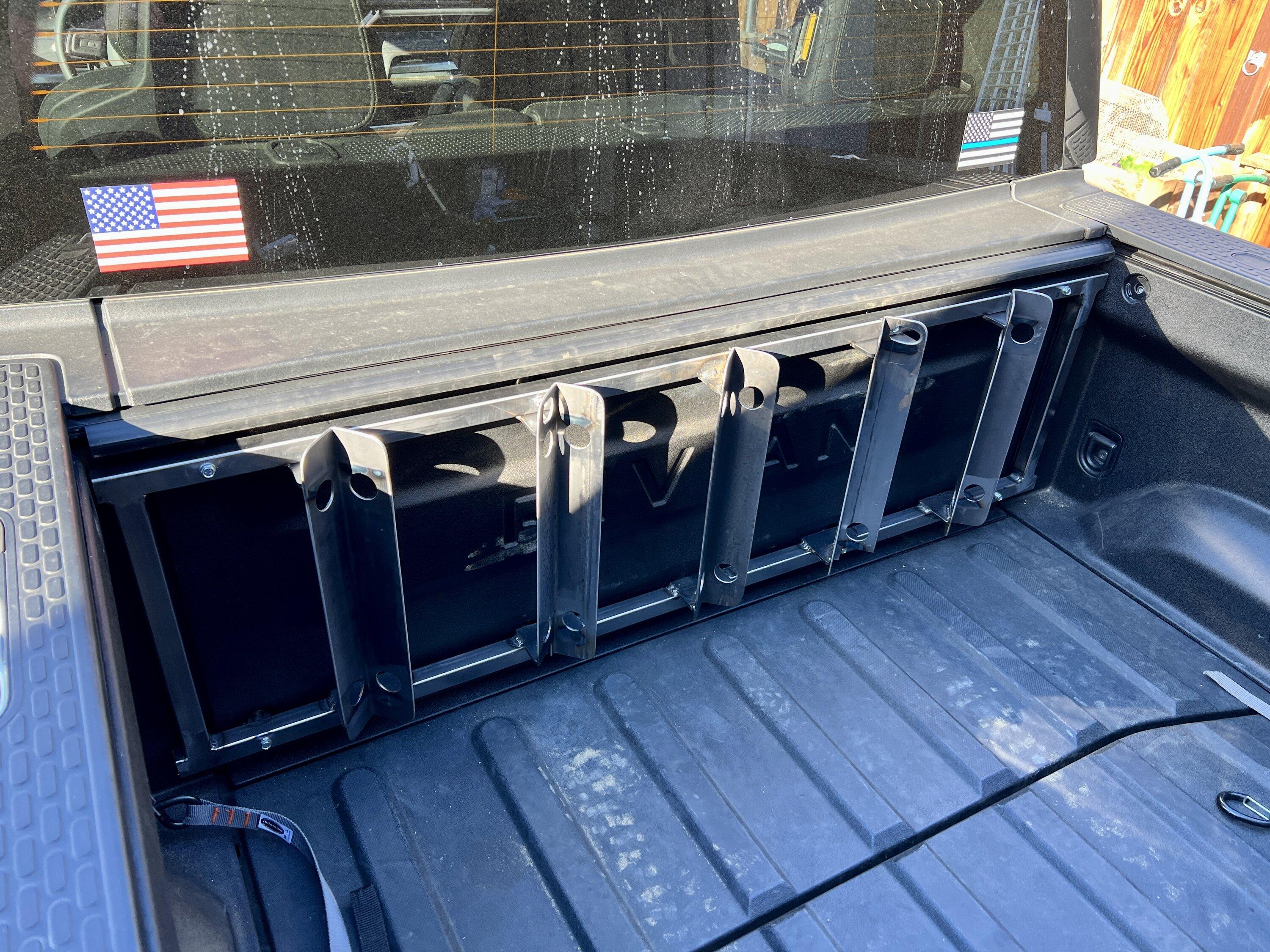 Rivian R1T R1S Motorcycle wheel chock system installed in the bed.  Just needs a coat of paint! IMG_2516.JPG