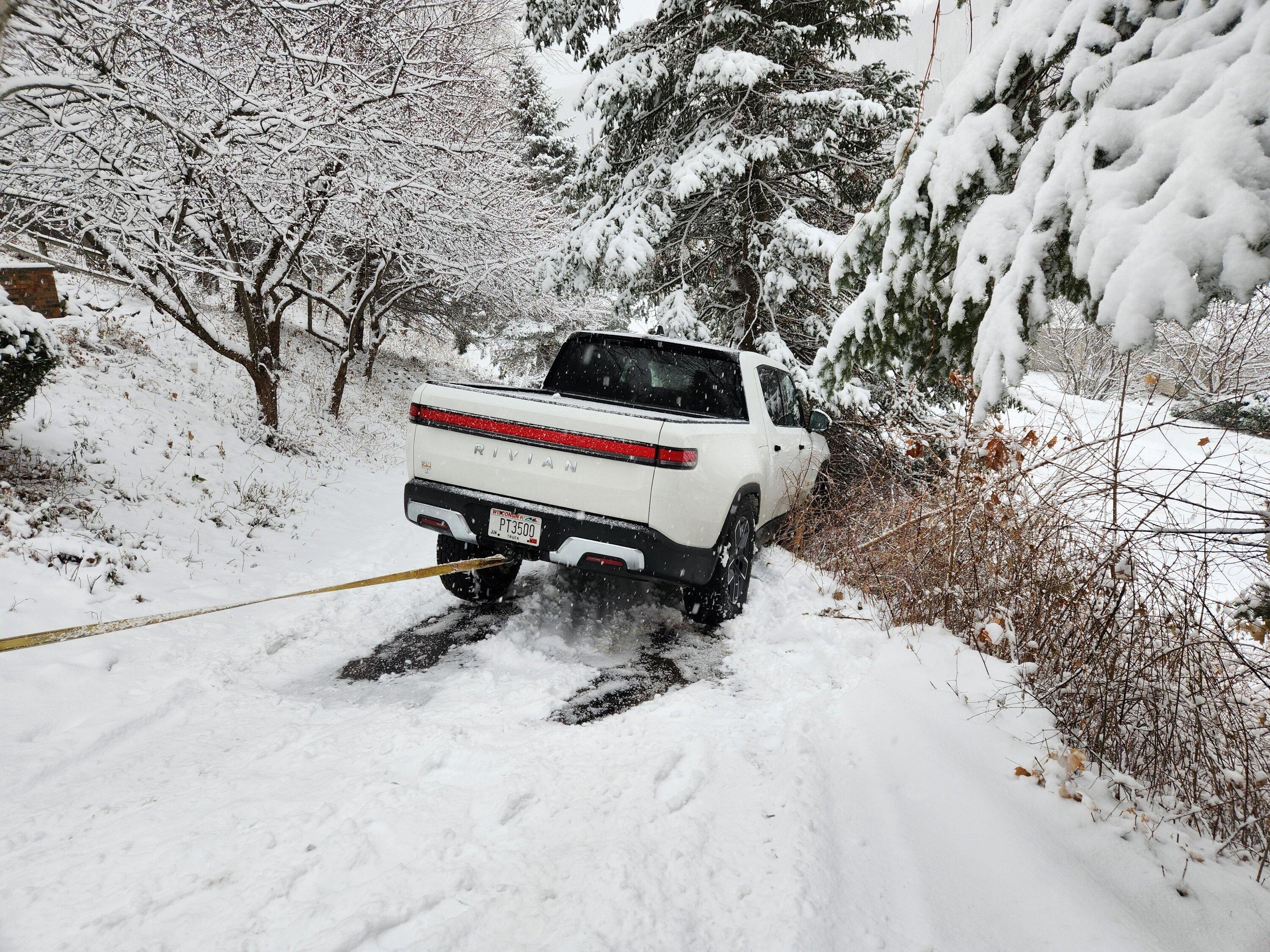 Rivian R1T R1S Guess I need some snow tires... my R1T hood now has a nice dent (on factory 20" A/T) 20221209_091805