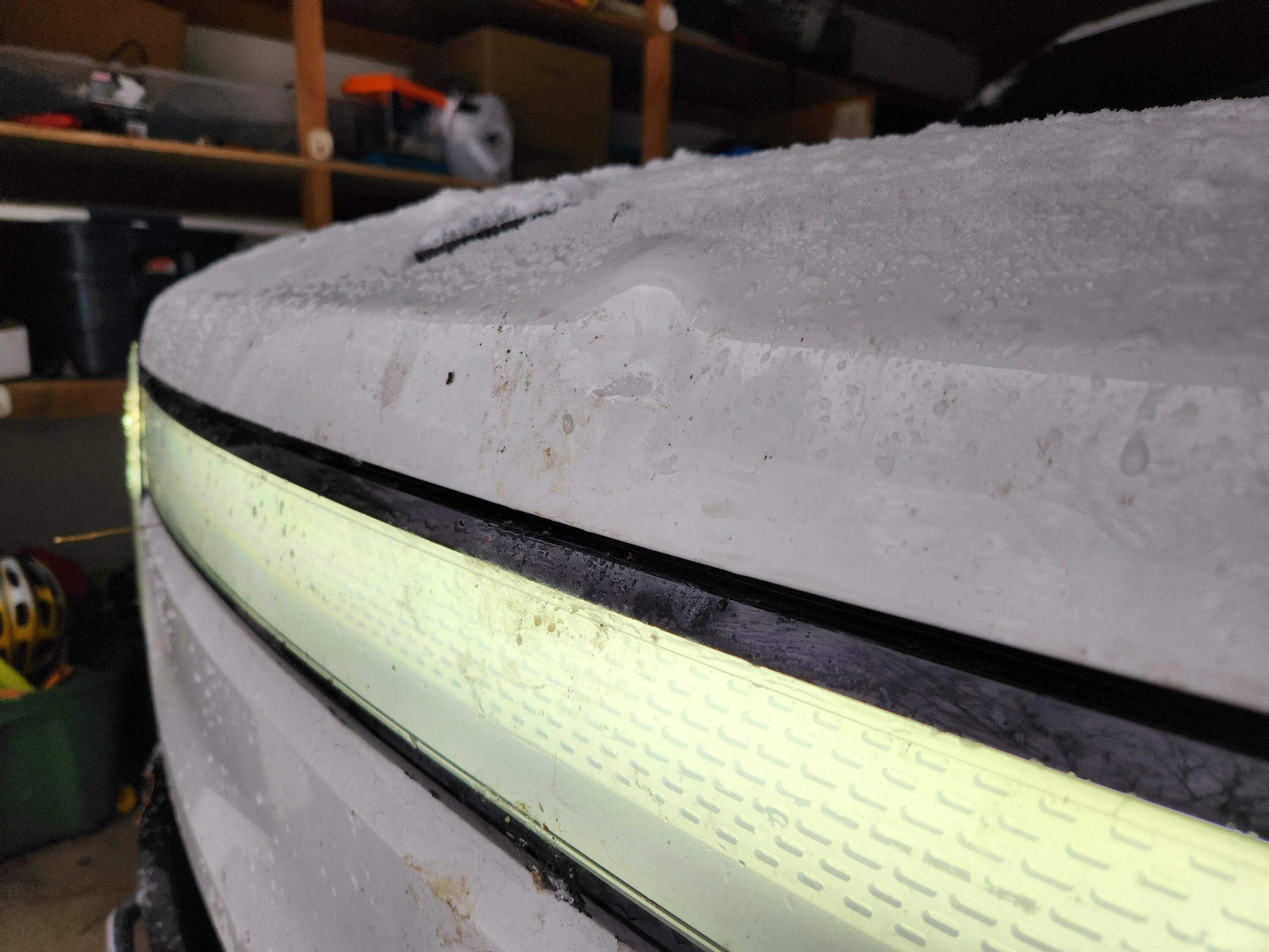 Rivian R1T R1S Guess I need some snow tires... my R1T hood now has a nice dent (on factory 20" A/T) 1670624681244