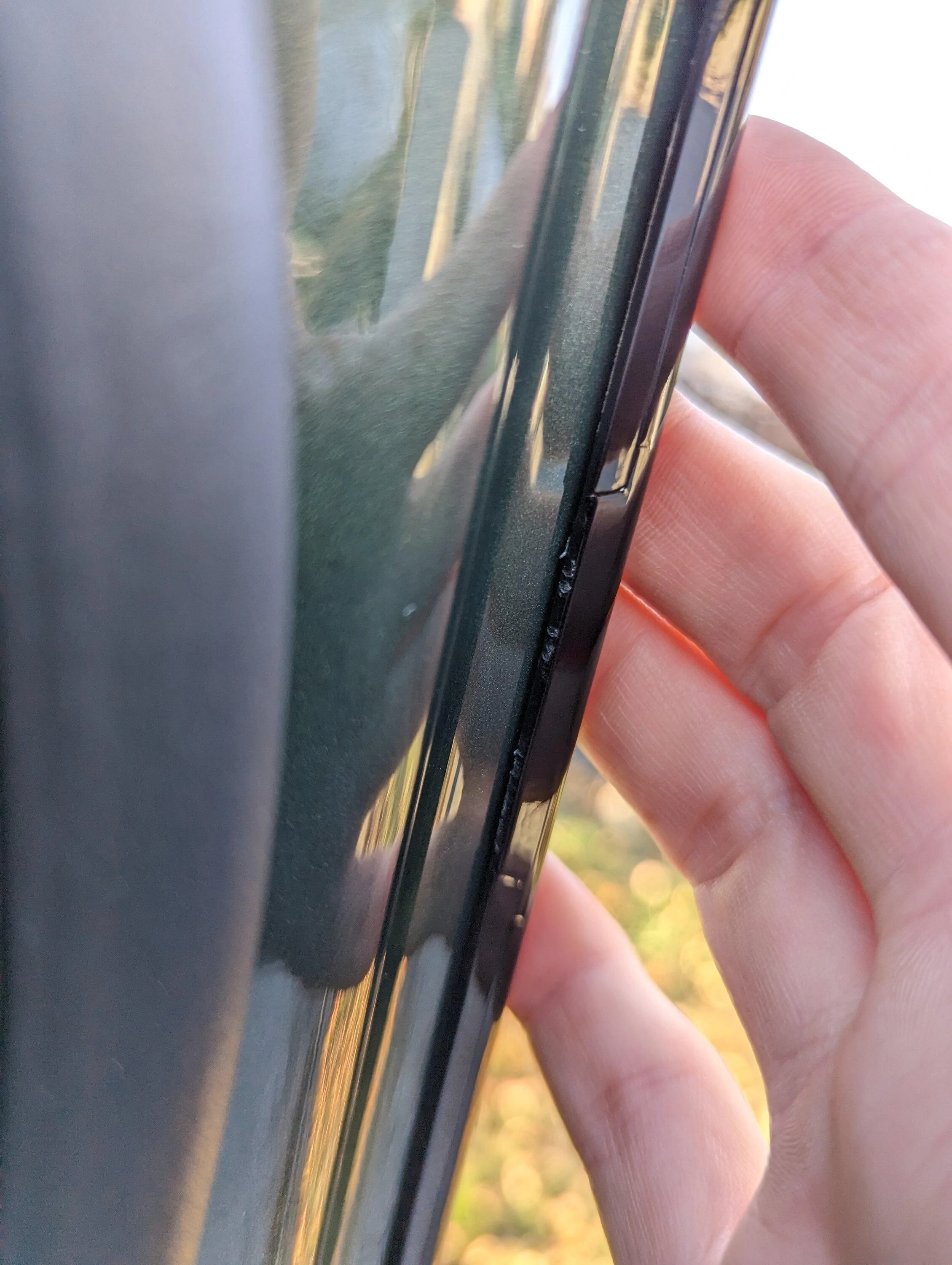 Rivian R1T R1S Front door edge paint gouges PXL_20221220_190816400