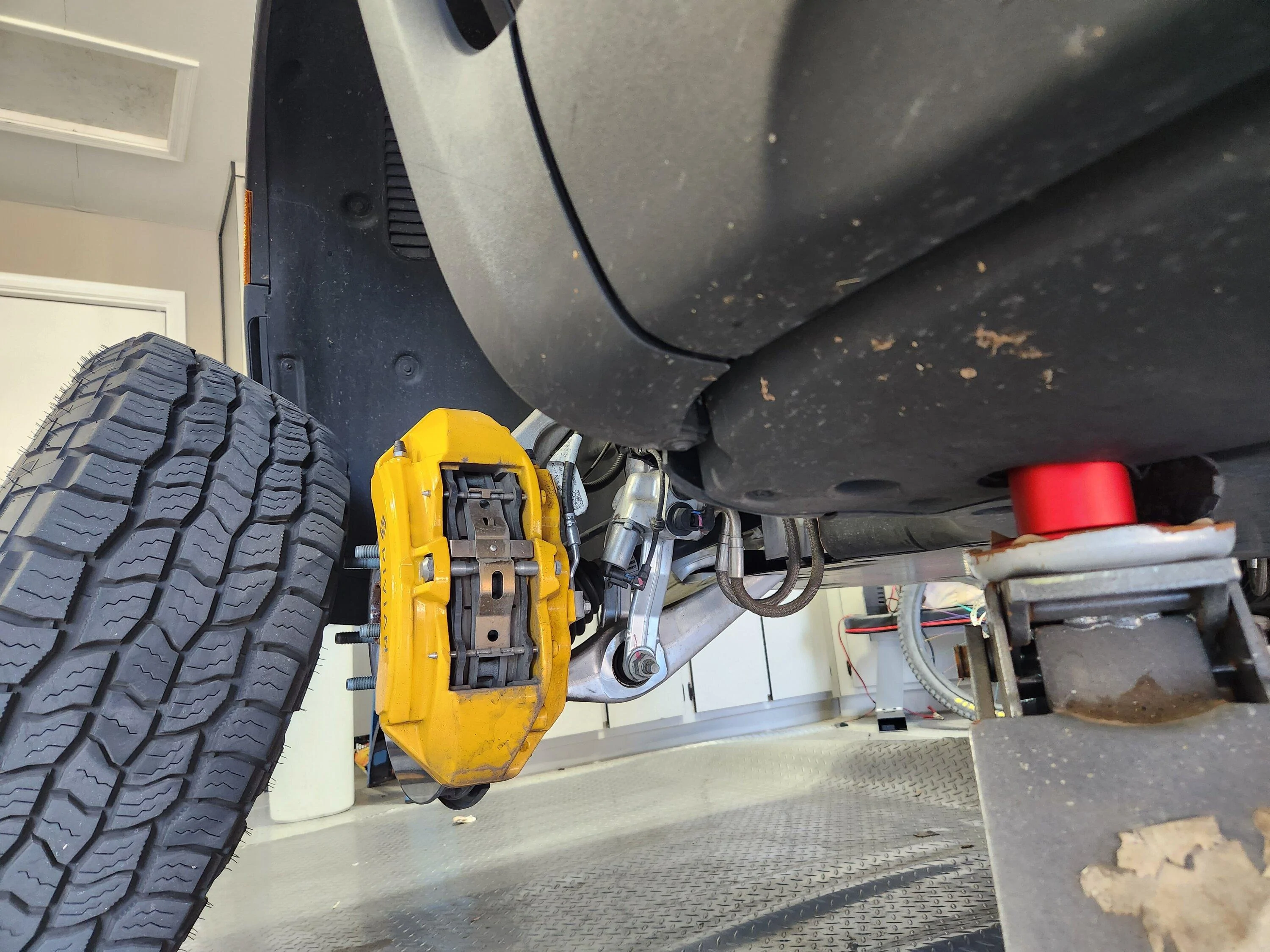 Rivian R1T R1S Jack pucks vs removing panels 20221222_135928