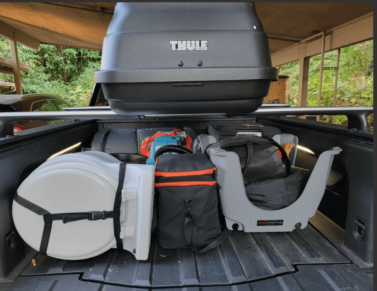 Rivian R1T R1S Portable toilet that fits under Tonneau? 1675795853973