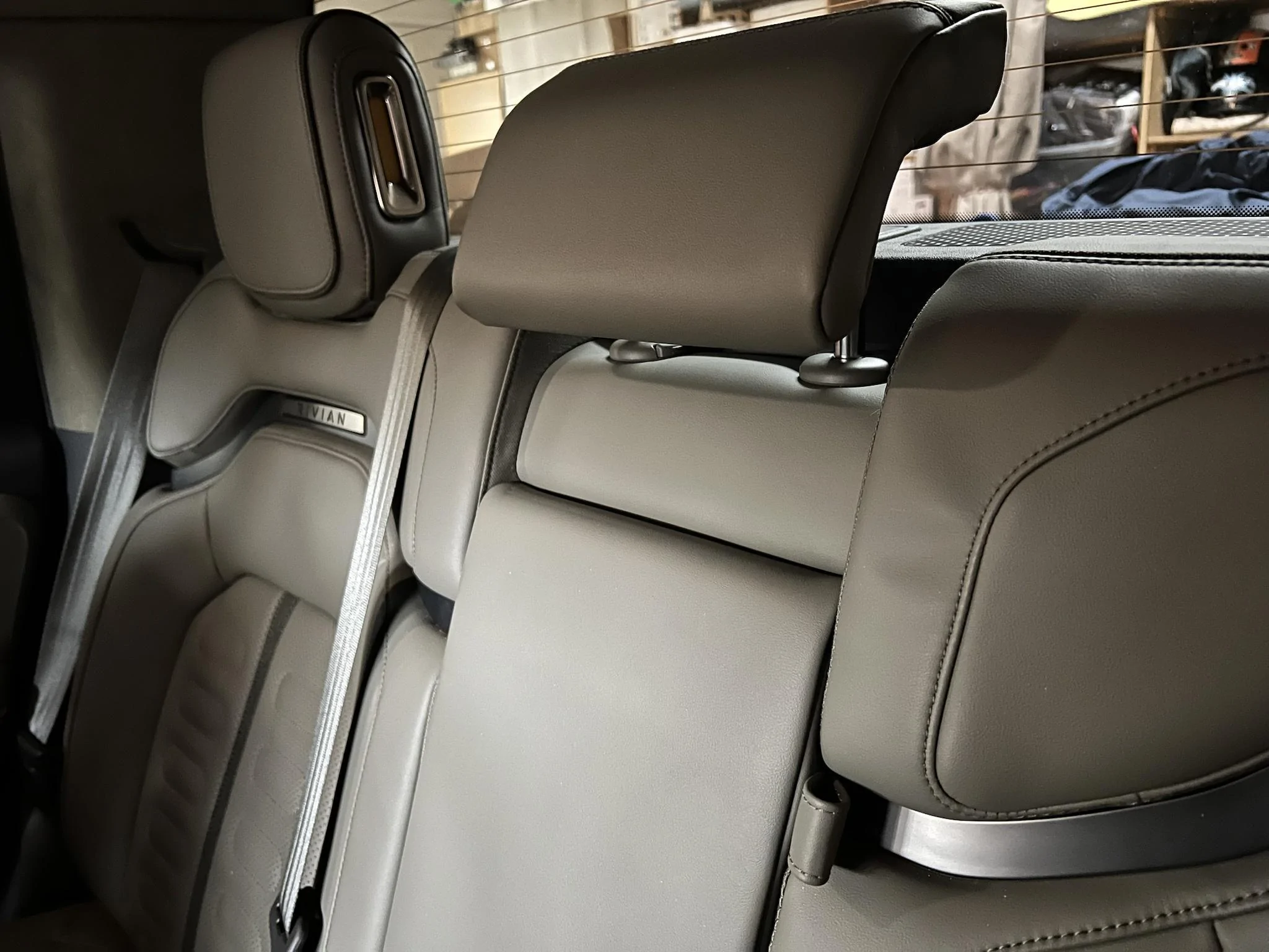 Rivian R1T R1S Do people really not know the R1T rear-center seat has a telescoping headrest? Piv1anD - Imgur