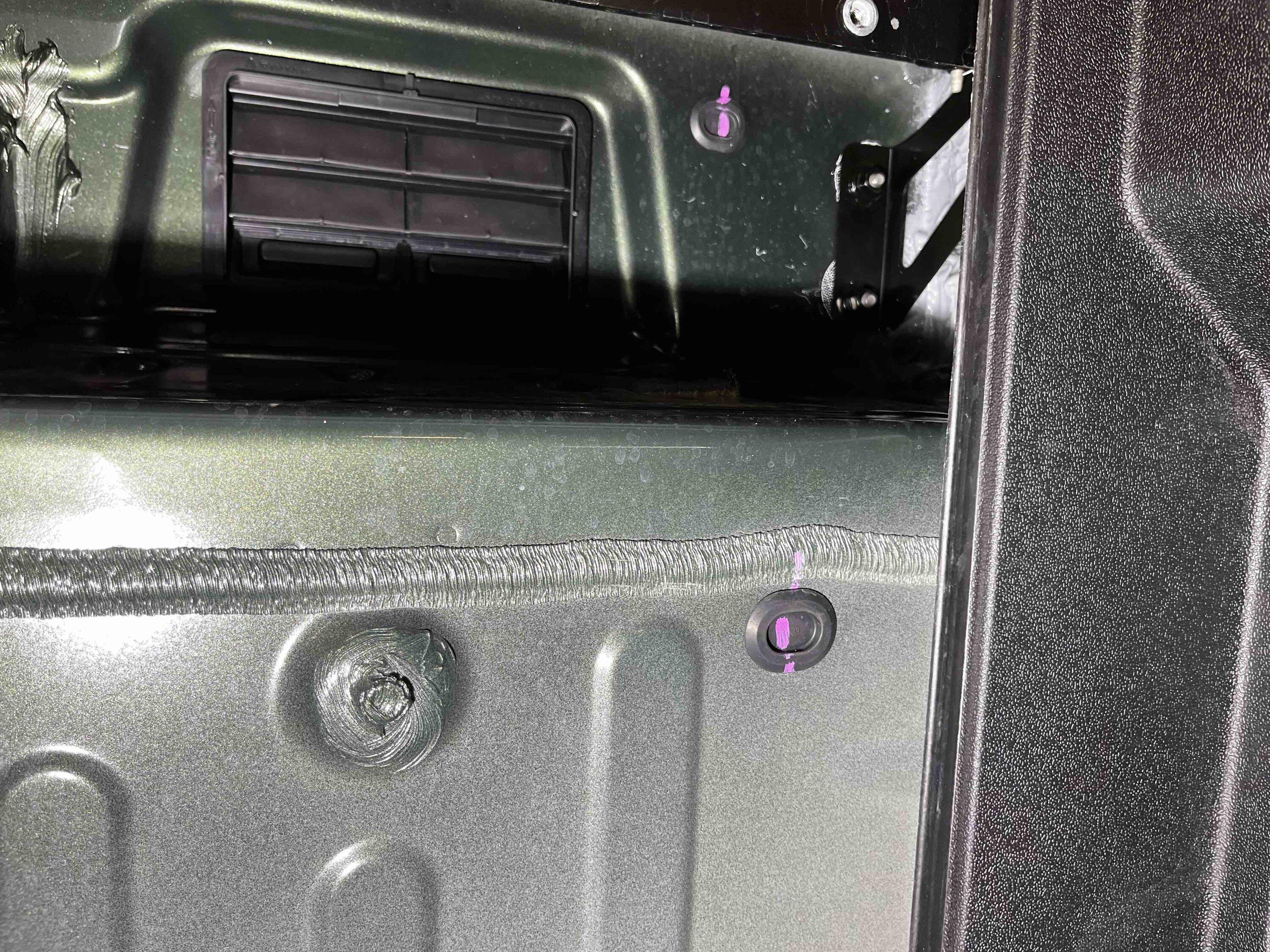 Rivian R1T R1S Reclaiming empty powered tonneau cover space 04GrommetPass