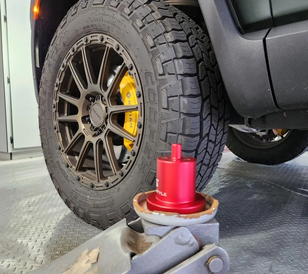Rivian R1T R1S Replacing AT tires w/ after market jack pucks com 1