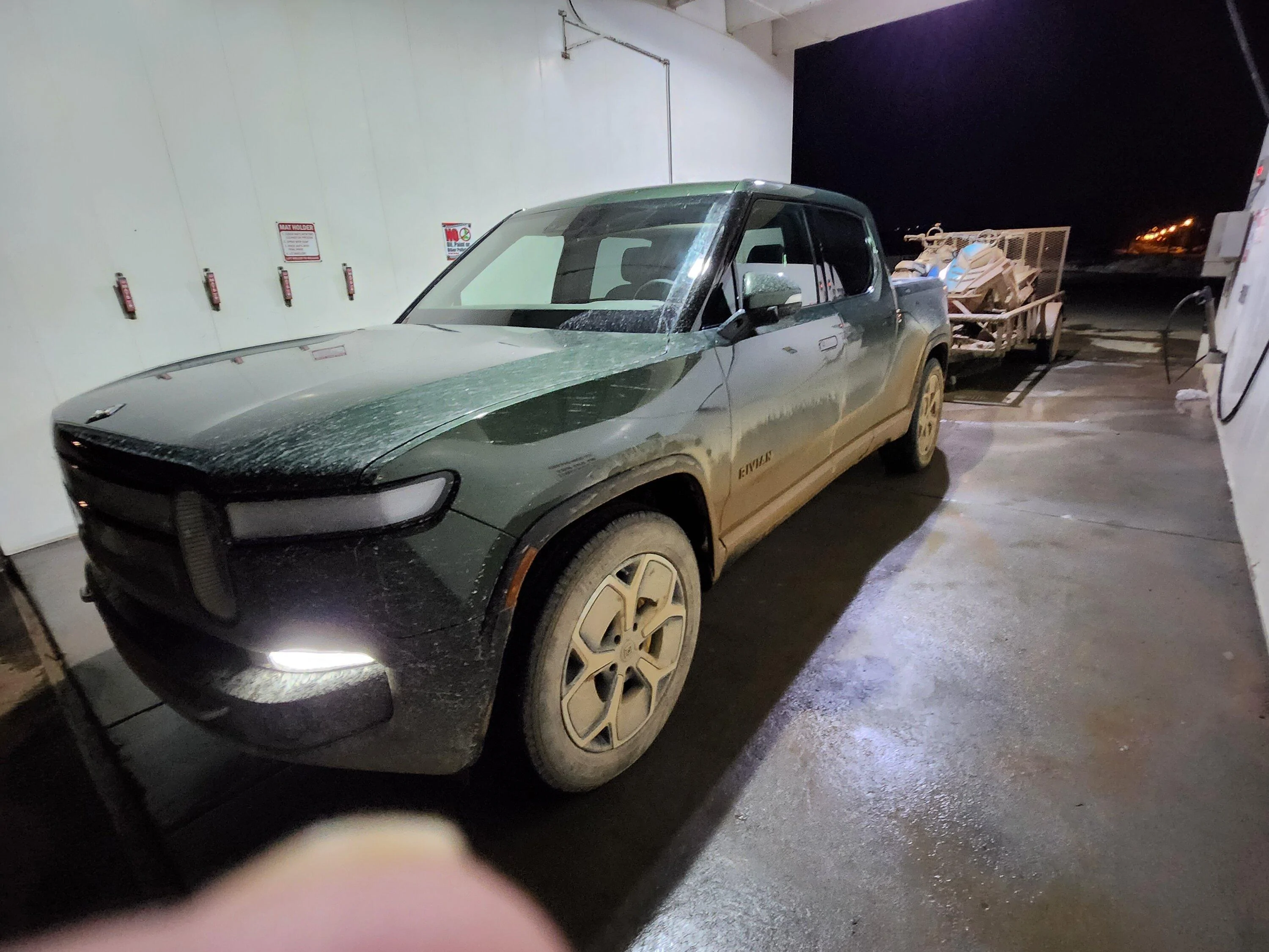 Rivian R1T R1S 21" AS wheels on gnarly mud, ice, and snow towing 2 snowmobiles -- tires performed very well! 20230408_205440