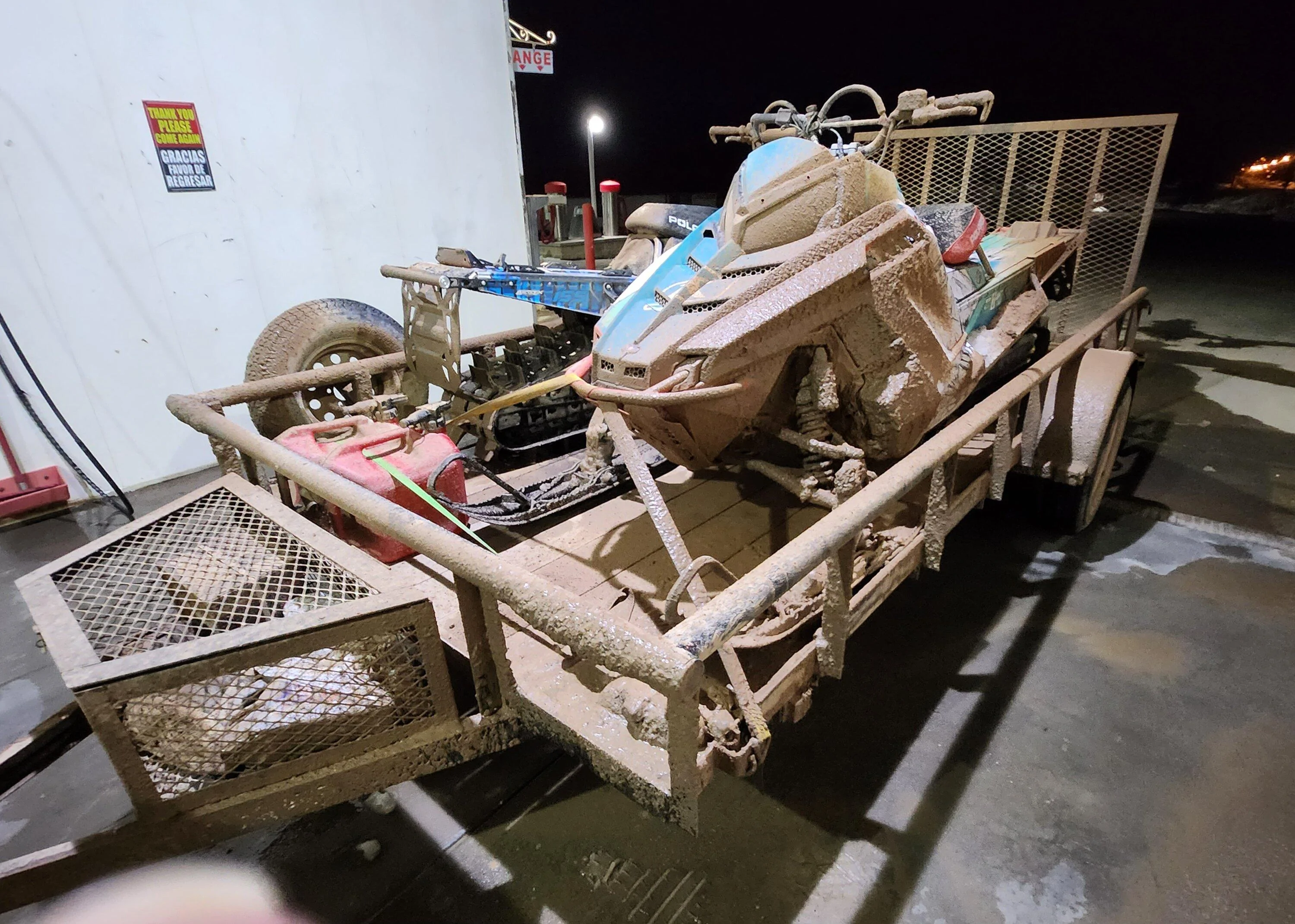 Rivian R1T R1S 21" AS wheels on gnarly mud, ice, and snow towing 2 snowmobiles -- tires performed very well! 20230408_205455