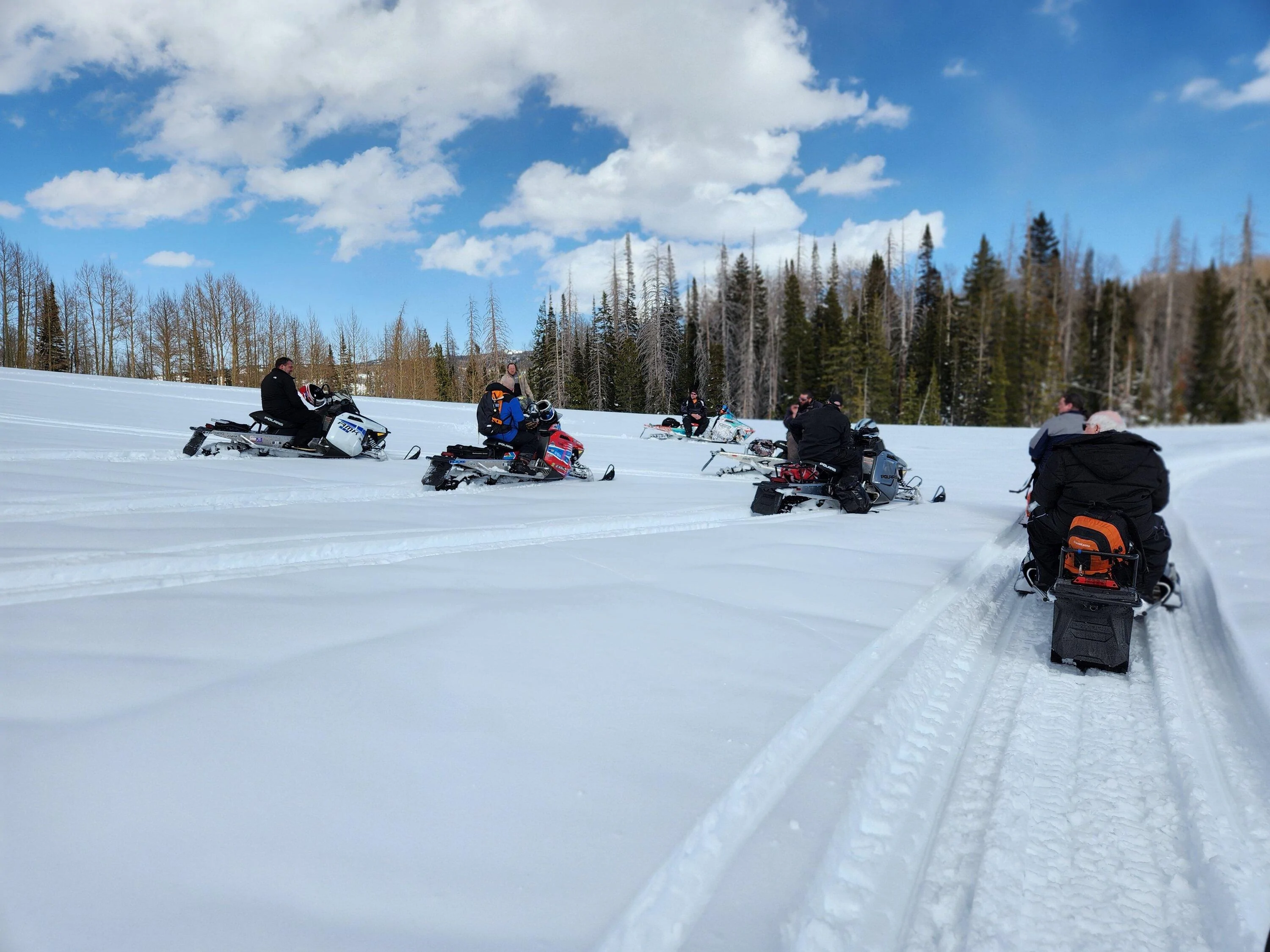 Rivian R1T R1S 21" AS wheels on gnarly mud, ice, and snow towing 2 snowmobiles -- tires performed very well! 20230408_162105