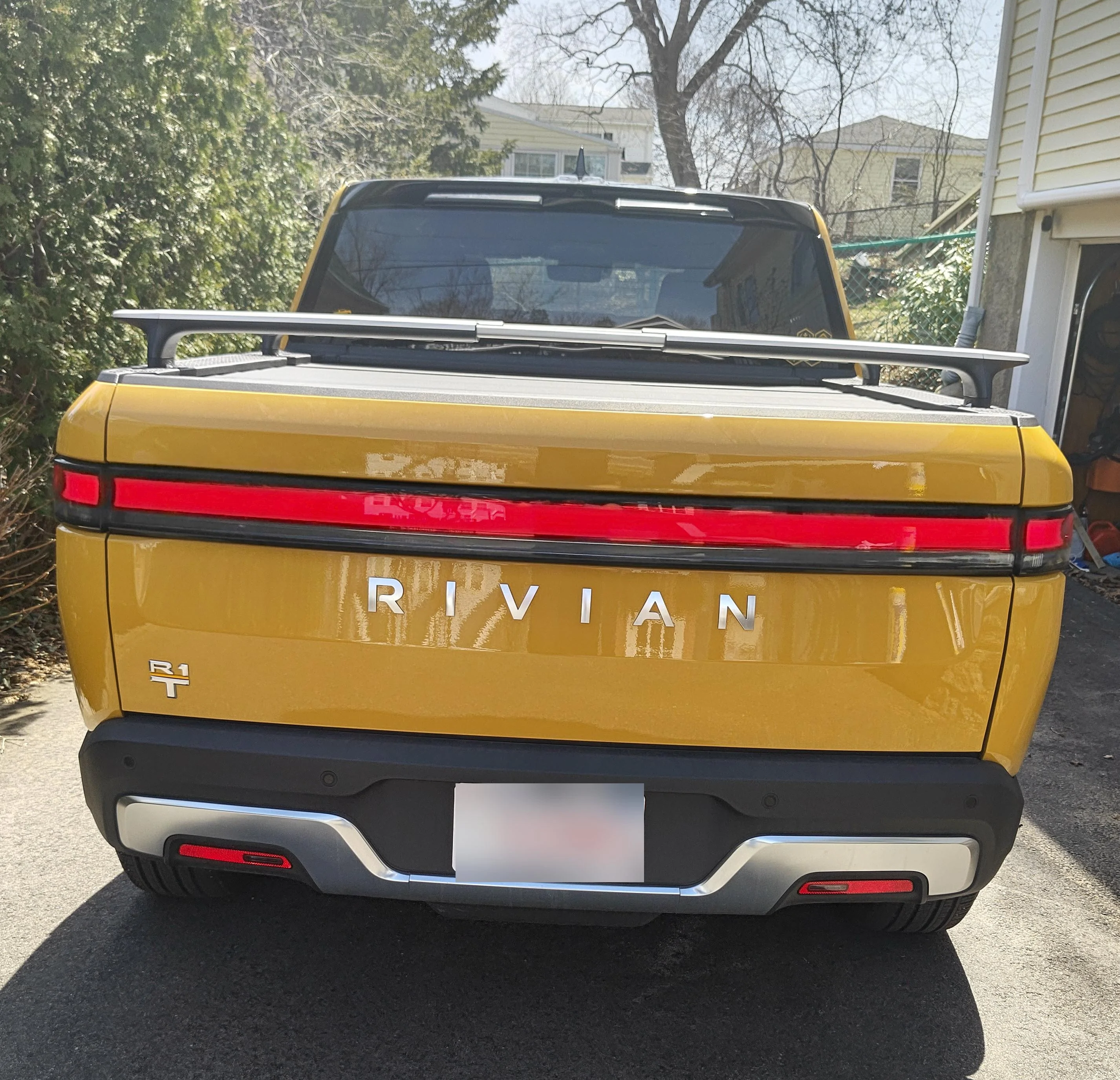 Rivian R1T R1S Blacked out my logos with vinyl crbackinsilver