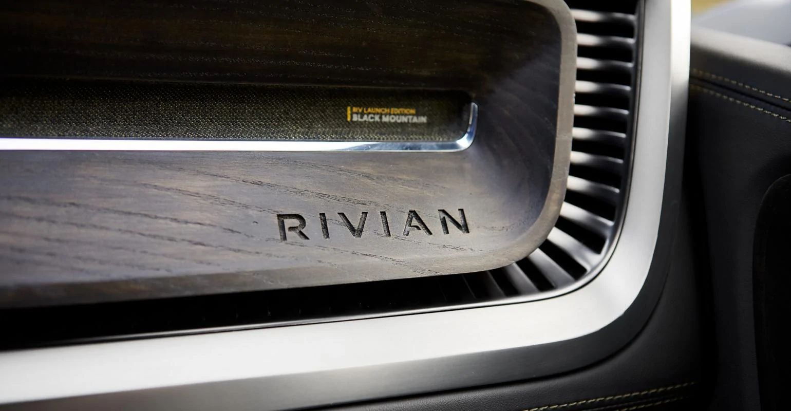 Rivian R1T R1S Closeup photo of Black Mountain wood interior + Interview with Rivian’s interior expert... Nice! Rivian%20Interior%20logo