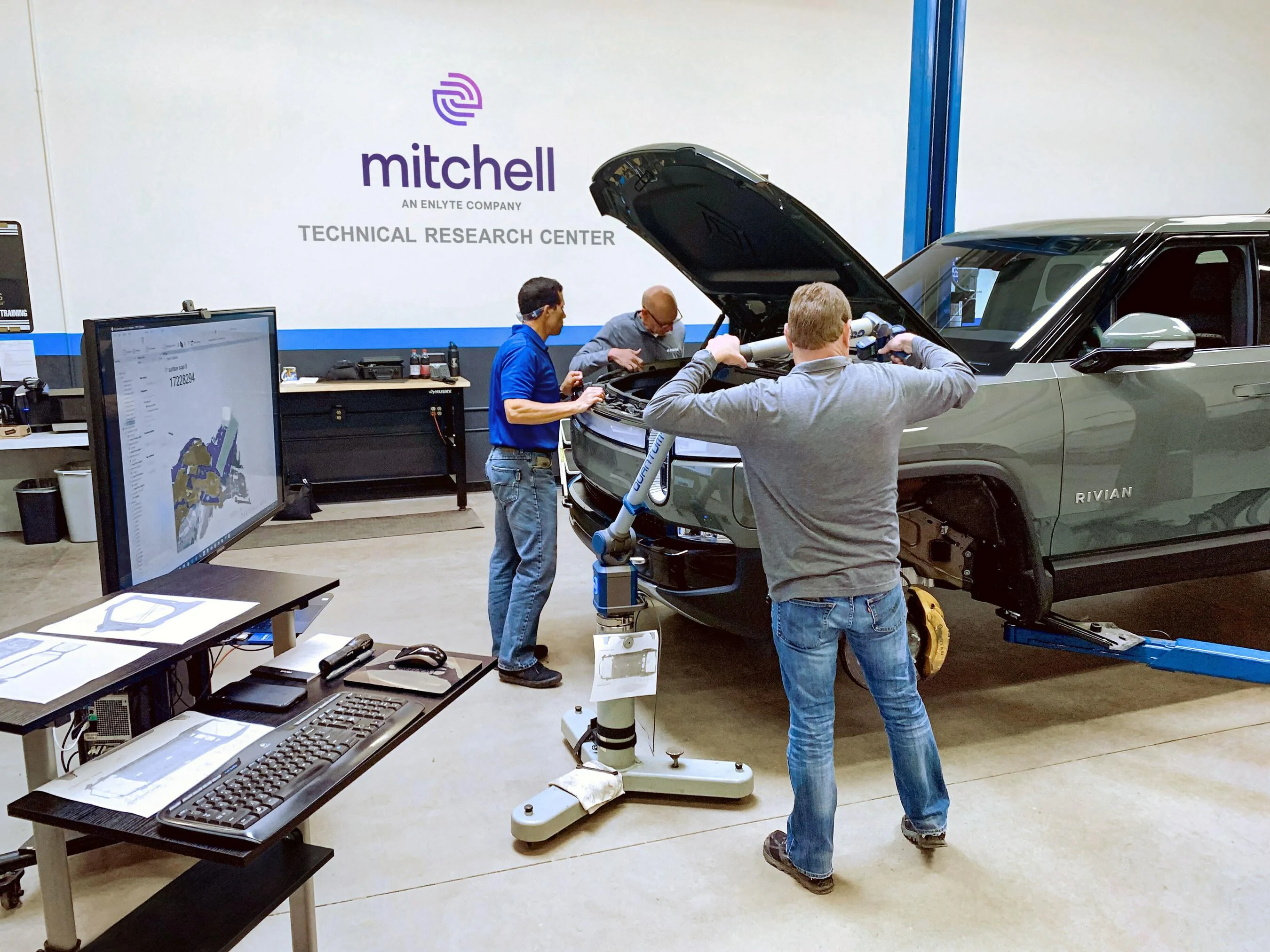 Rivian R1T R1S Rivian signs first data licensing agreement with Mitchell to expedite collision repairs Mitchell_employees_collect_3D_measurements