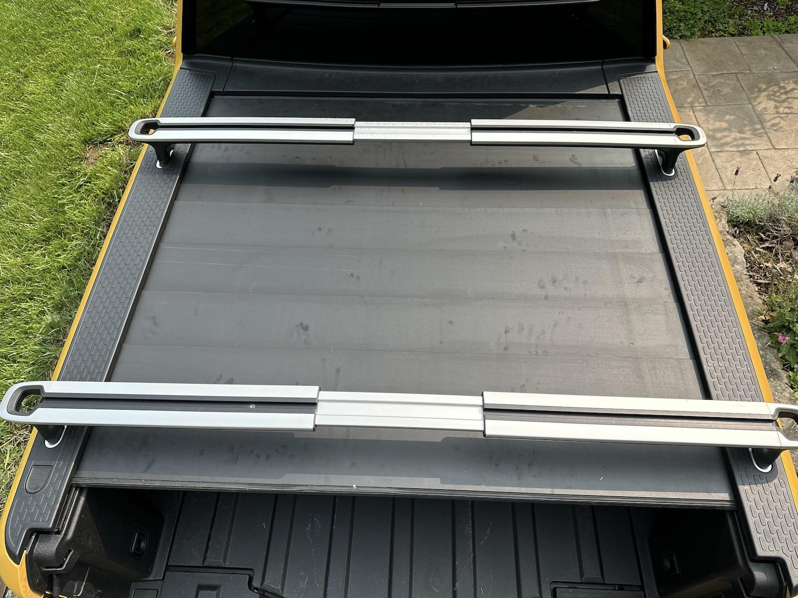 Rivian R1T R1S My tramp stamp temporary fix for my powered tonneau 1 slats installed.JPG