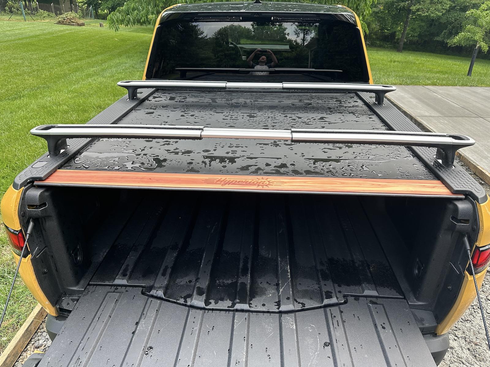 Rivian R1T R1S My tramp stamp temporary fix for my powered tonneau 5 installed with weatherstripping.JPG