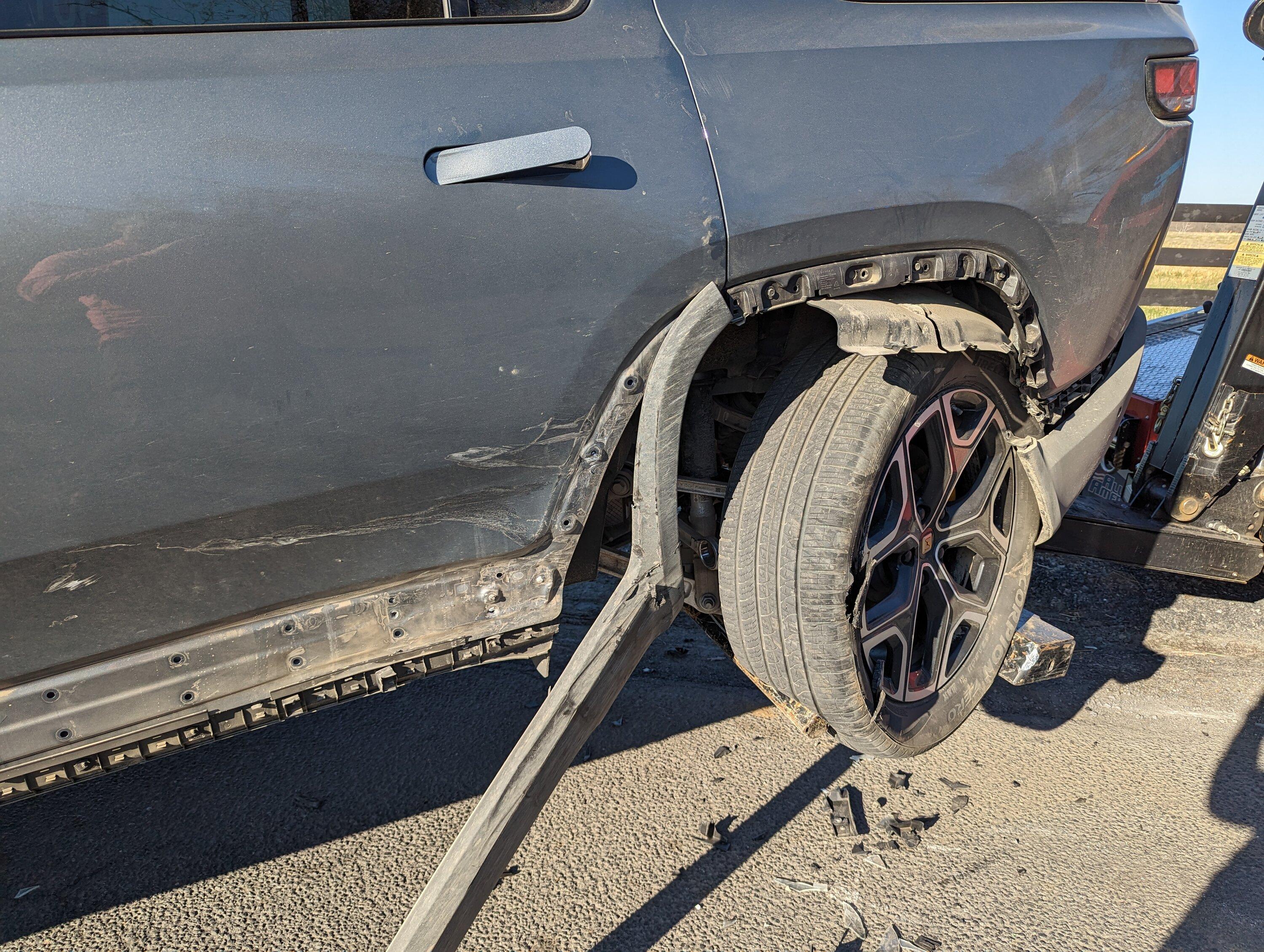 Rivian R1T R1S Totaled R1S after side impact accident at stop sign Wheel closeu