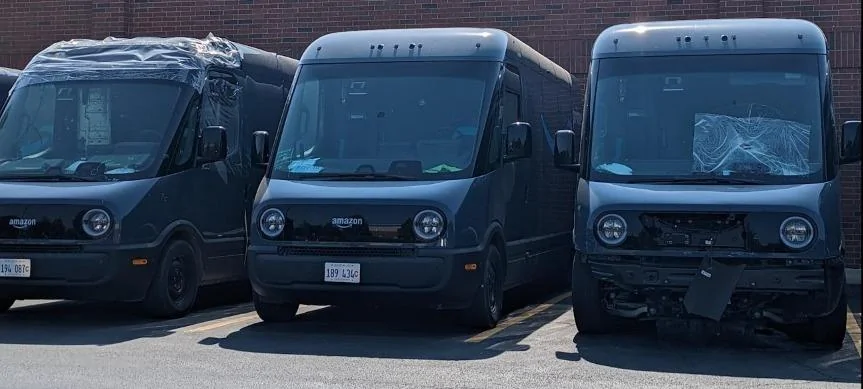 Rivian R1T R1S Amazon vans at collision repair qHULBf5