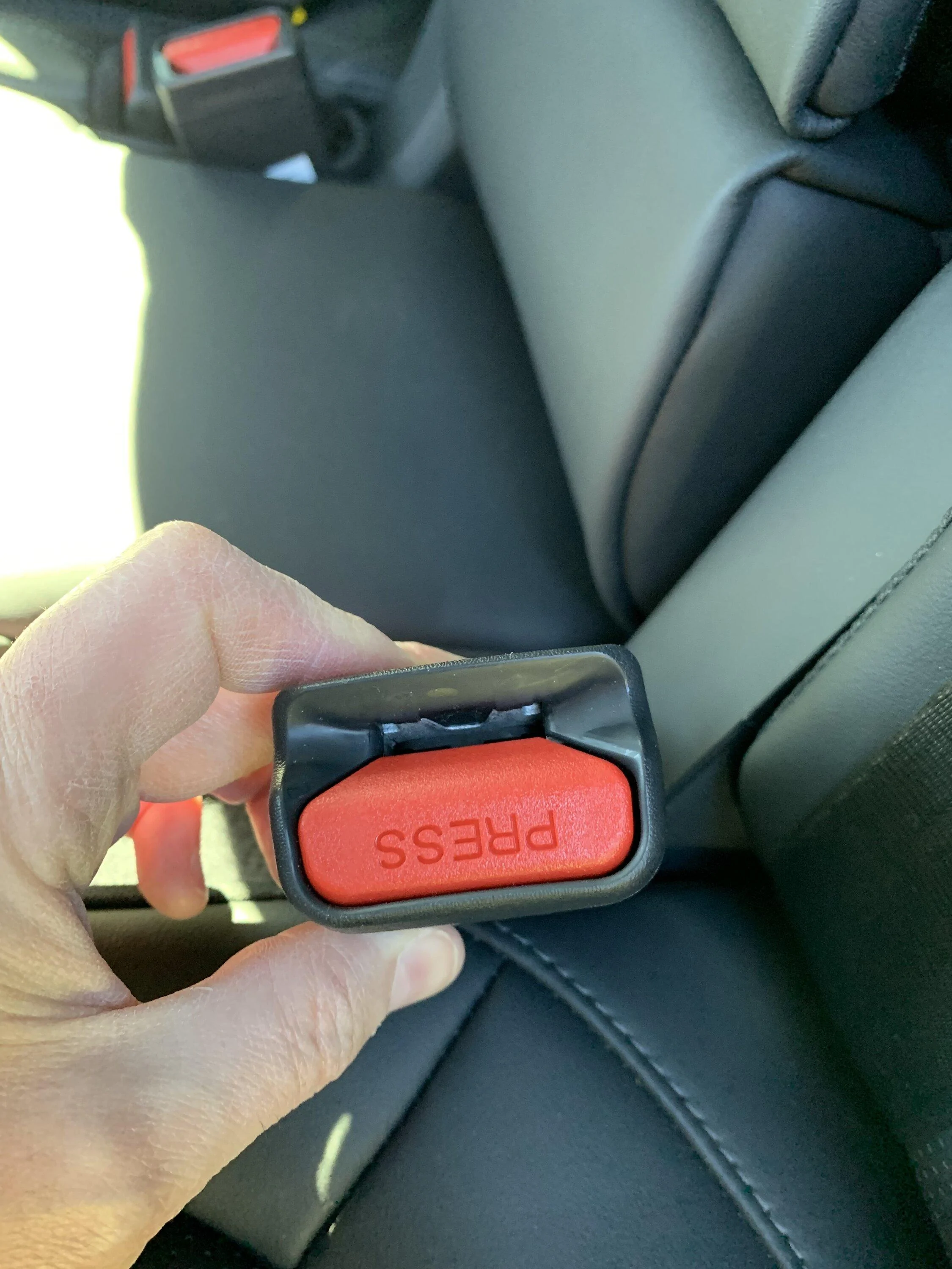 Rivian R1T R1S Car seat buckle backwards? IMG_0501