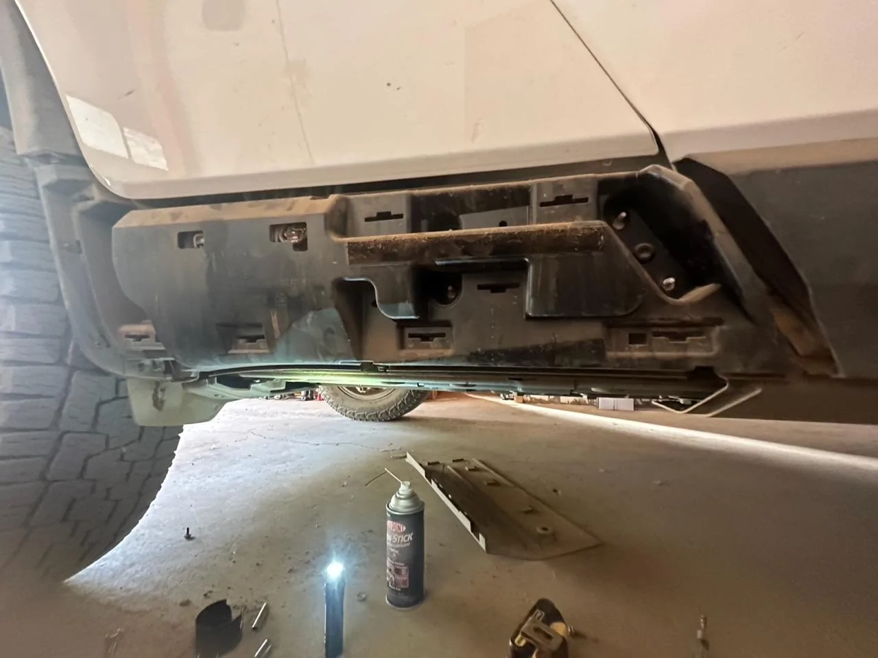 Rivian R1T R1S Gear tunnel door squeak fix.  Lube points. IMG_0605