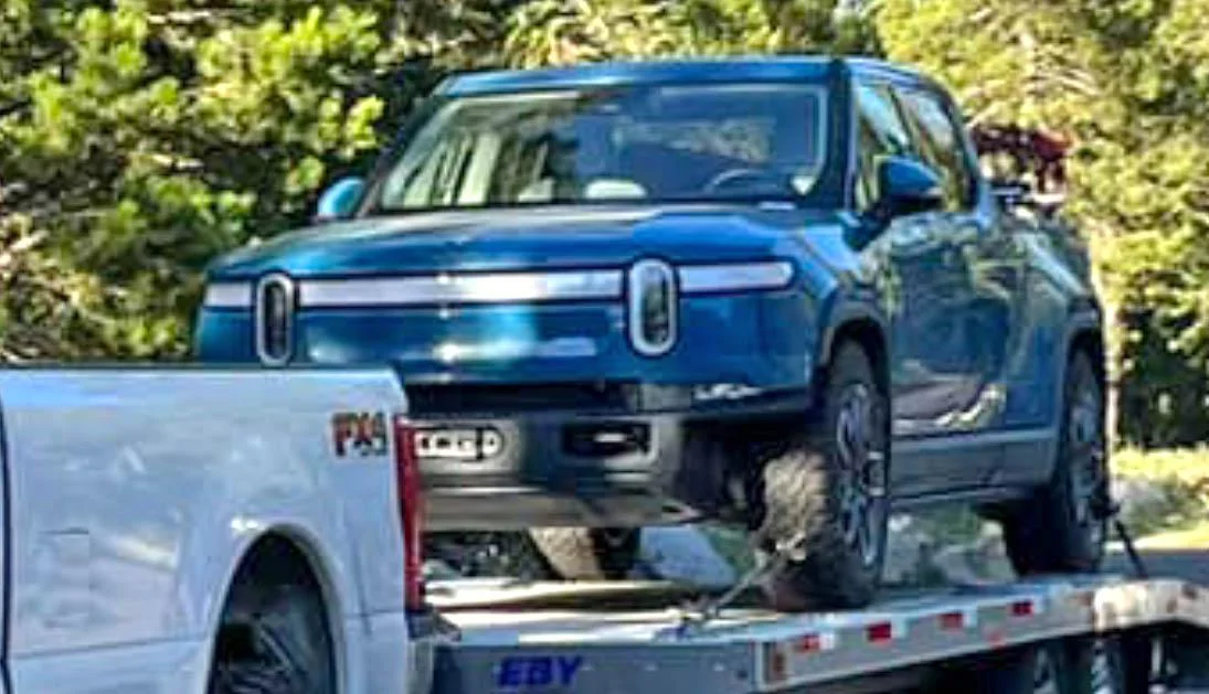 rivian sliders rock rails winch.jpg