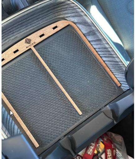 Rivian R1T R1S When will Rivian release new design for wireless charging pad? charger