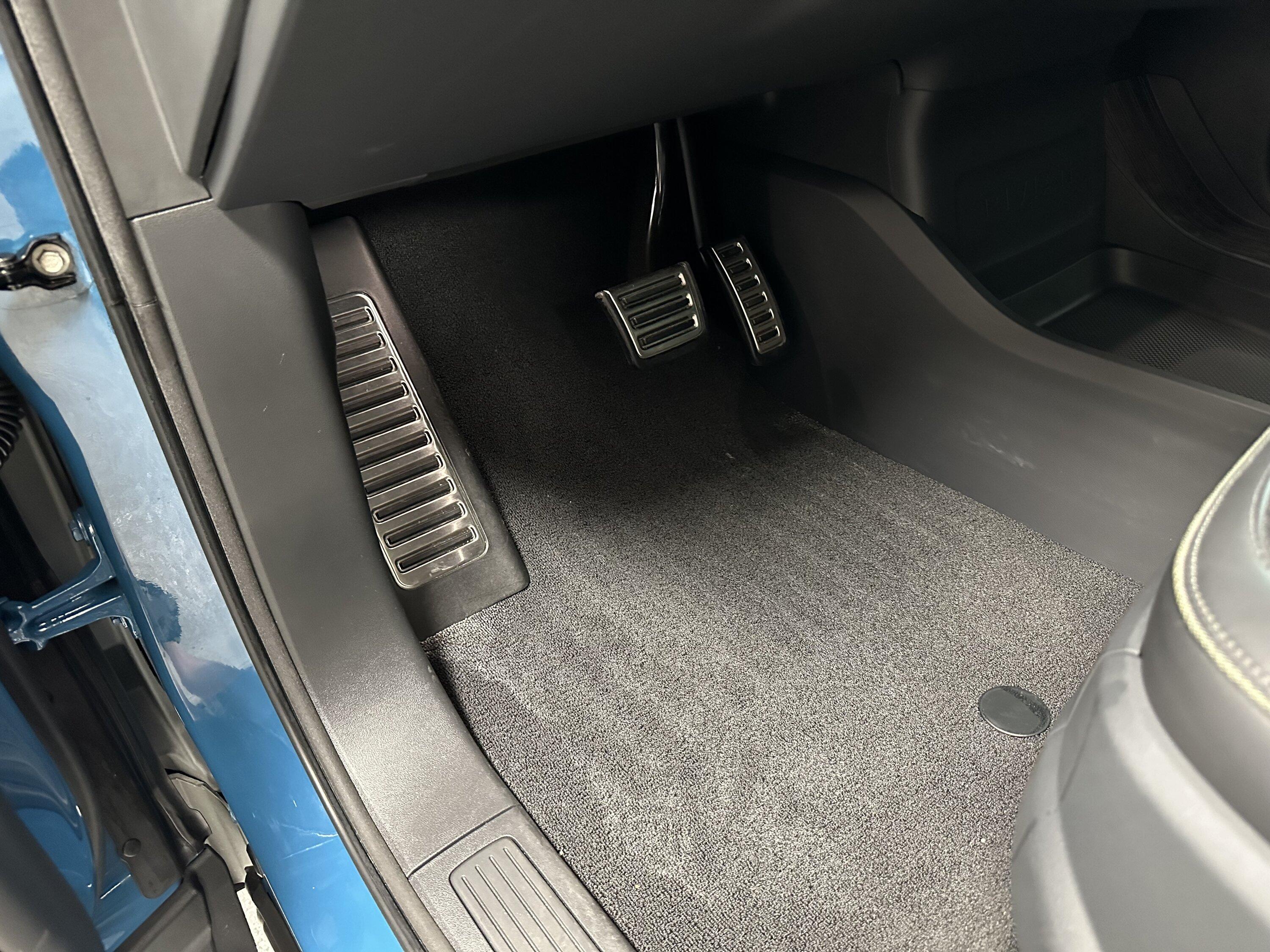 Rivian R1T R1S Wet spot under driver mat IMG_0450