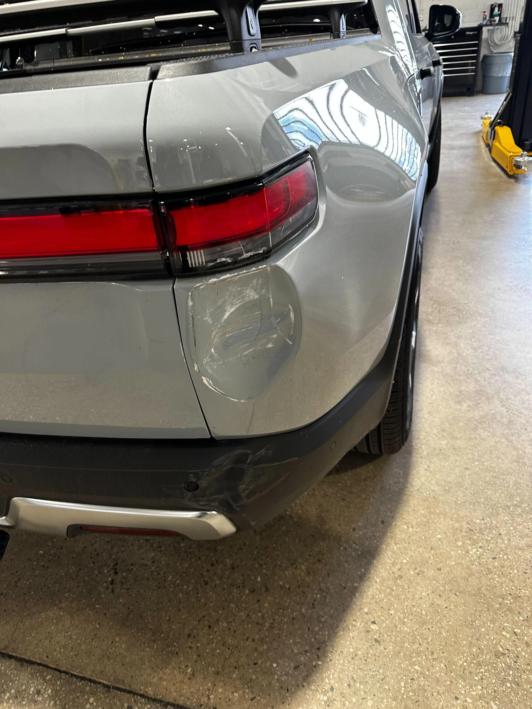 Rivian R1T R1S Hit by an EDV while sitting at the service center IMG_2406