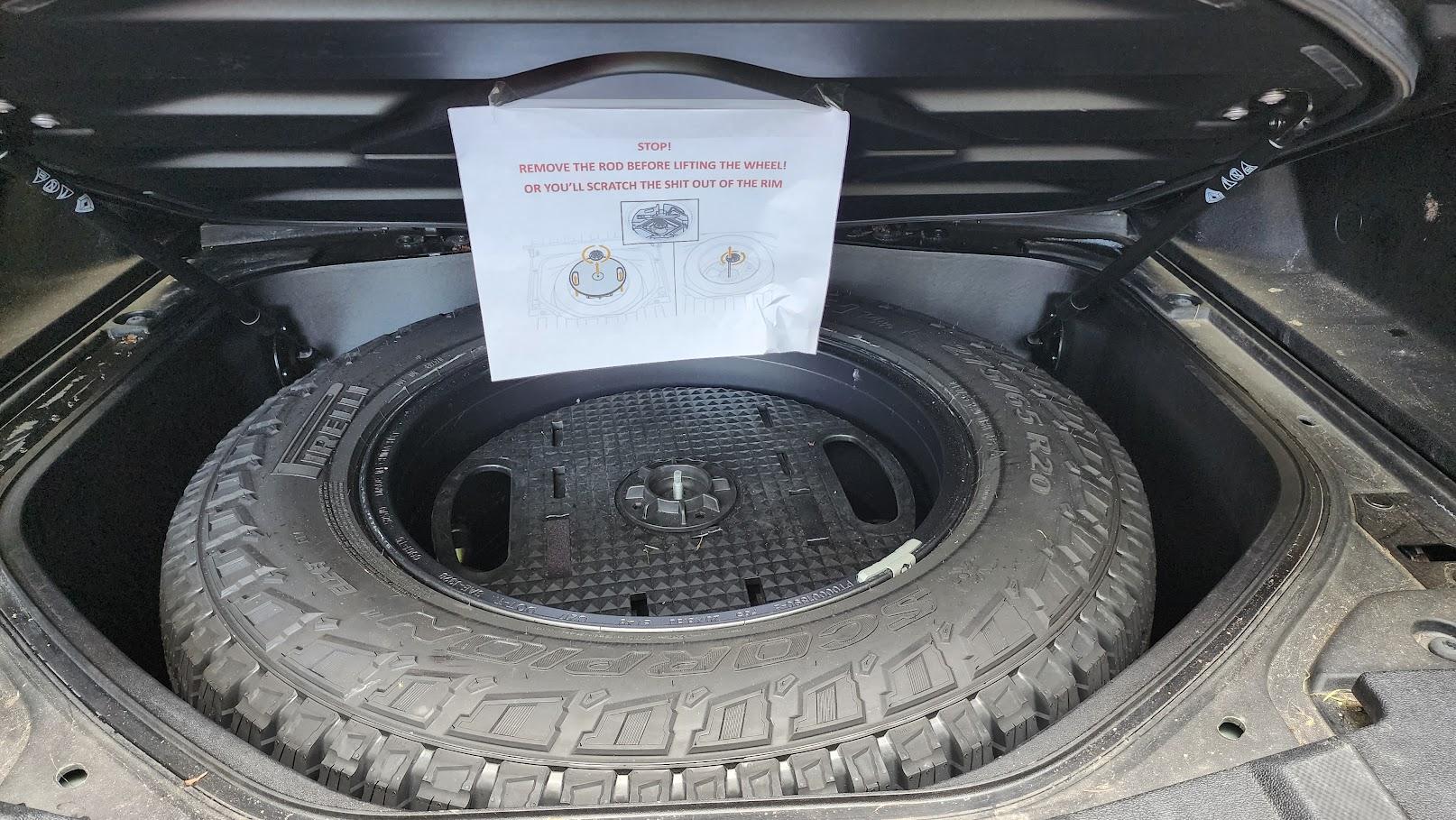 Rivian R1T R1S PSA : print this sign before using spare tire / tire rotation by tire shop 1696272178984