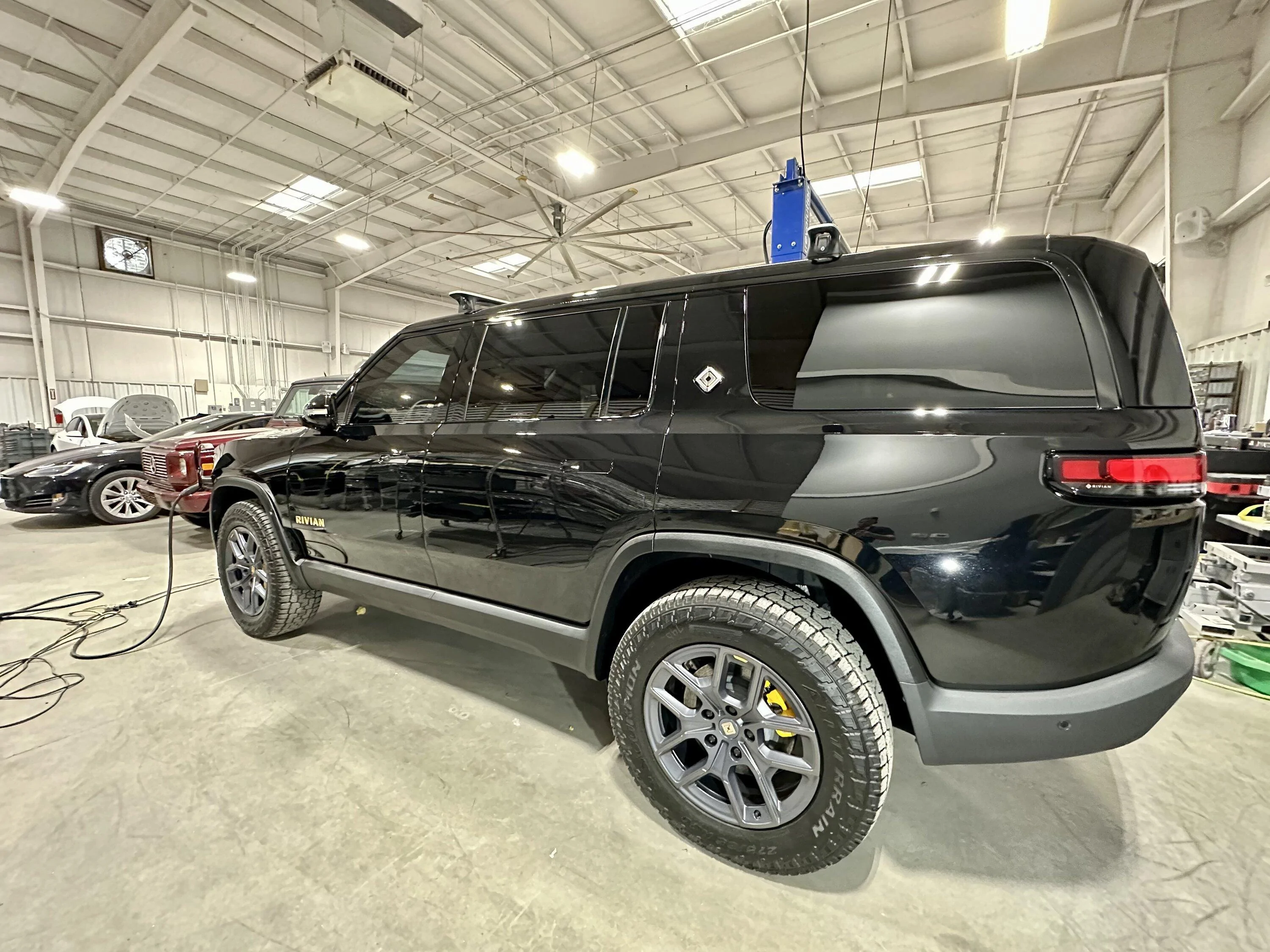 Rivian R1T R1S Hit by an EDV while sitting at the service center IMG_4082