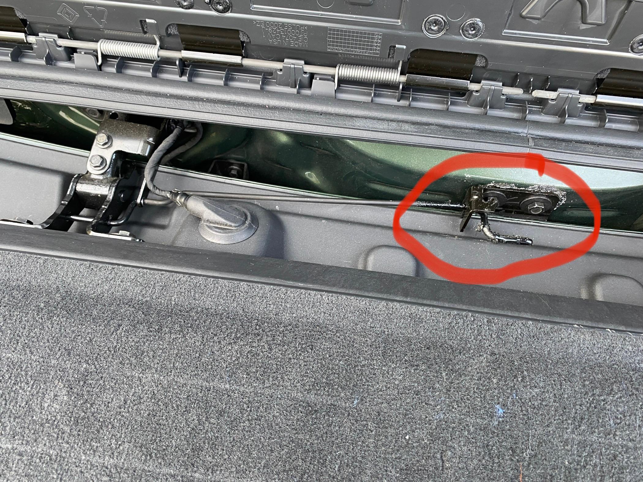Rivian R1T R1S Torsion bar under tailgate flap before1
