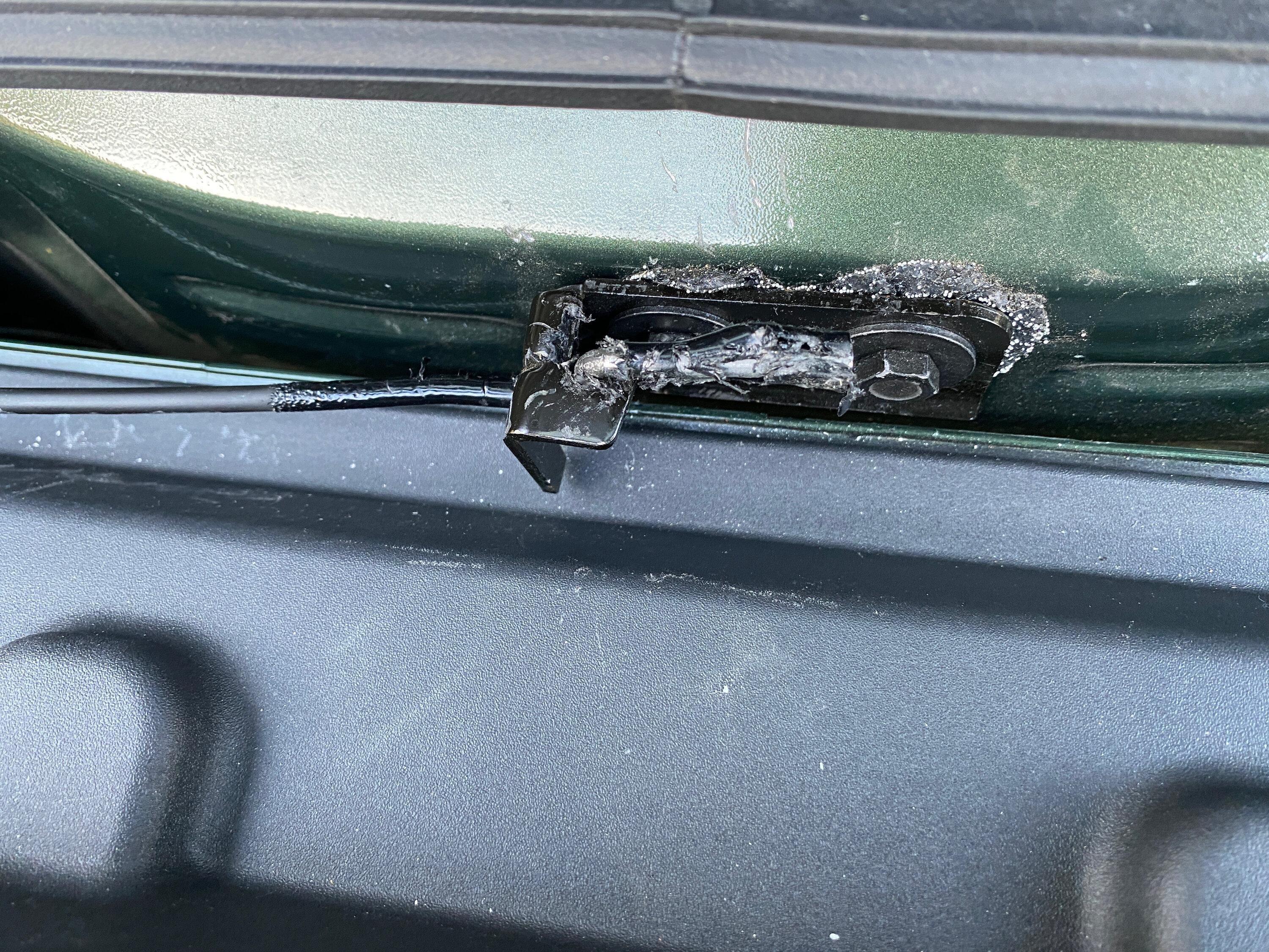 Rivian R1T R1S Torsion bar under tailgate flap after2