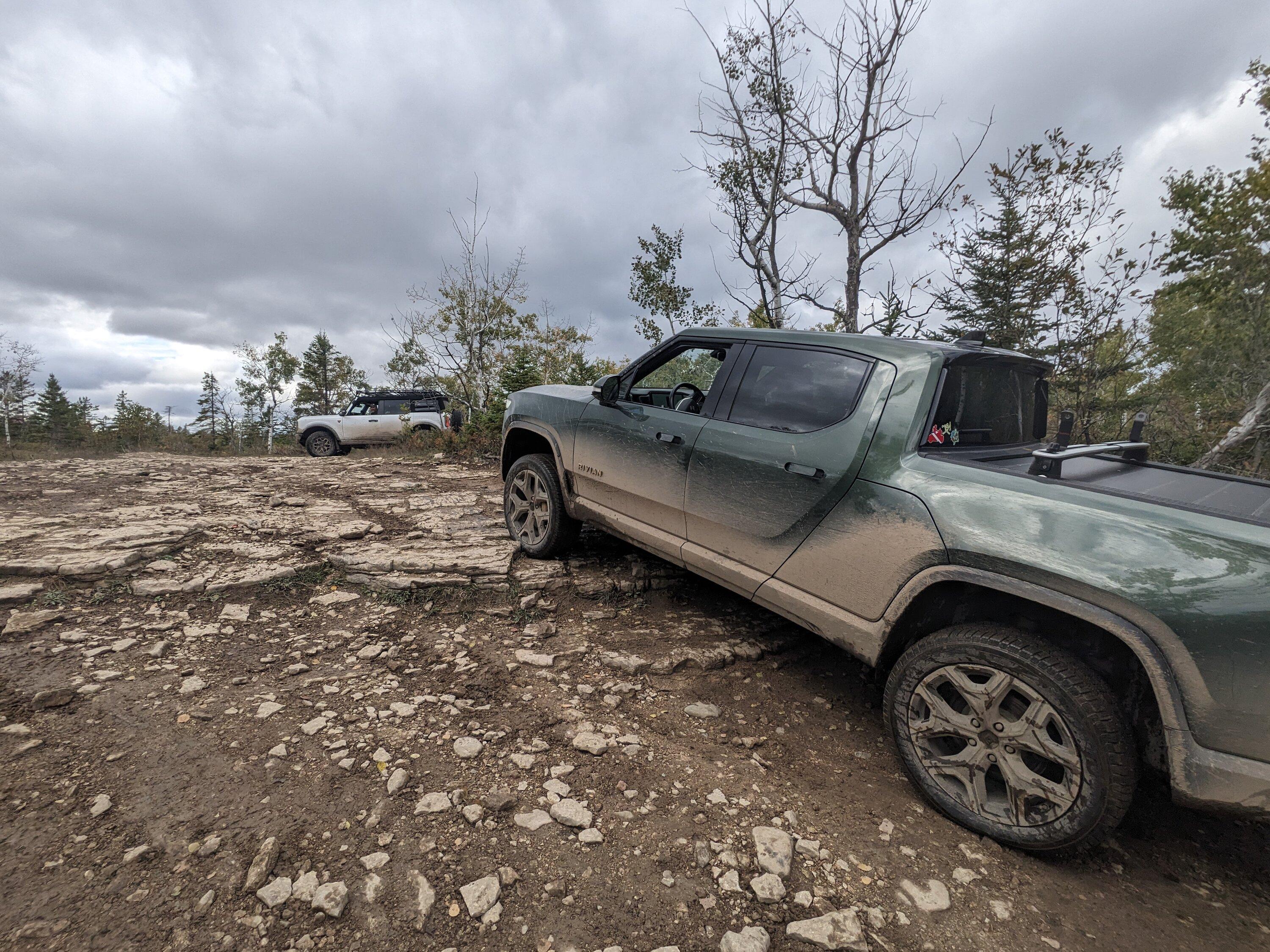Rivian R1T R1S Off-roading on Drummond Island, Michigan with R1T + Bronco PXL_20231007_190703260