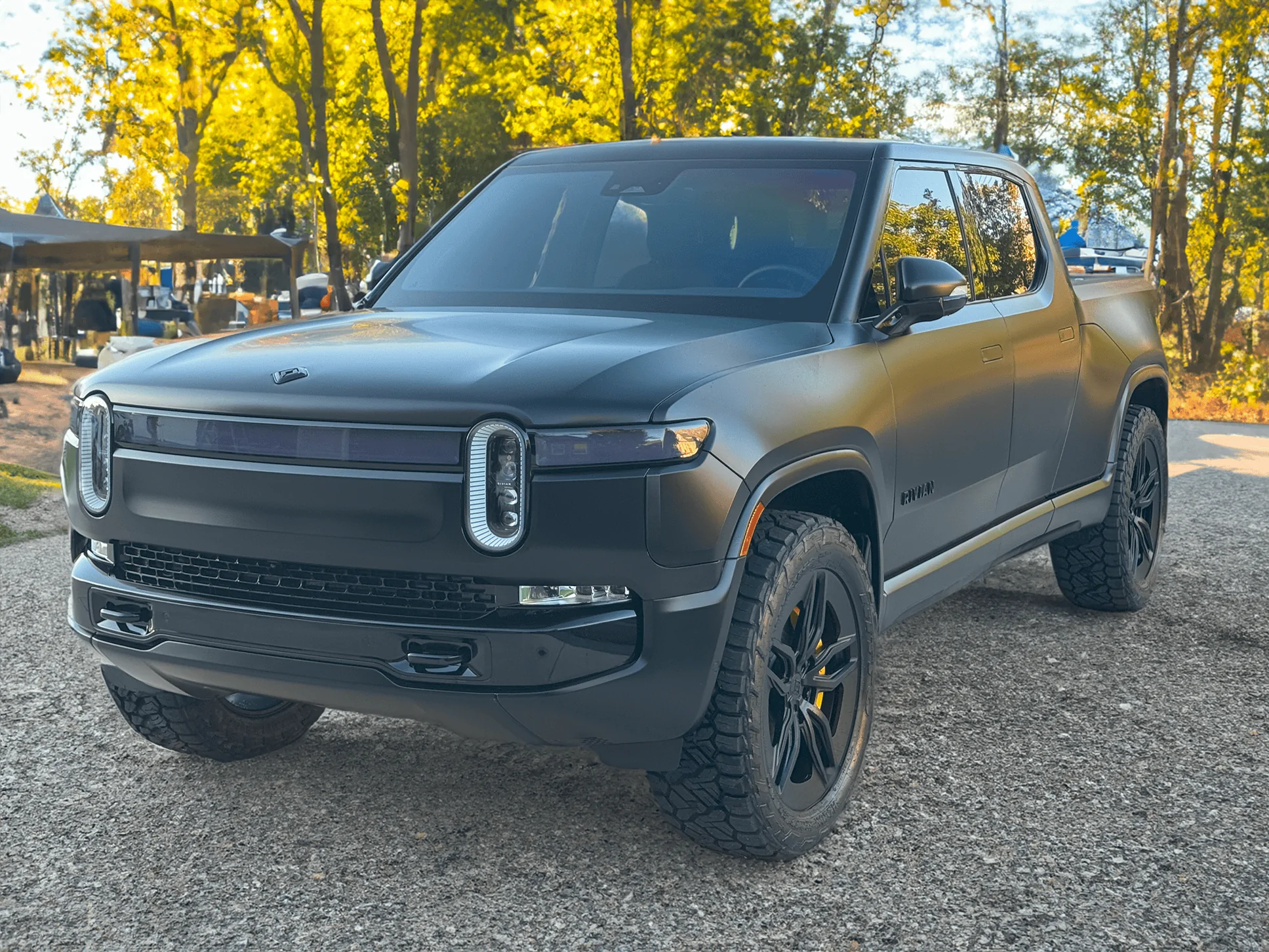 Rivian R1T R1S Project Midnight R1T Front Driver at campsite small