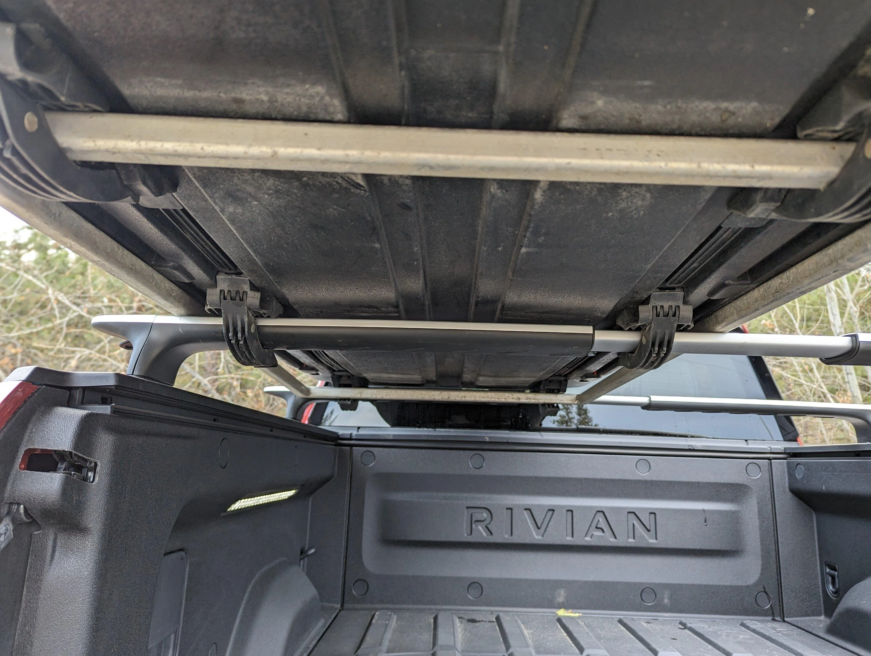 Rivian R1T R1S Yakima Carbonite ski box installation over bed PXL_20231120_170821846.LONG_EXPOSURE-01.COVER