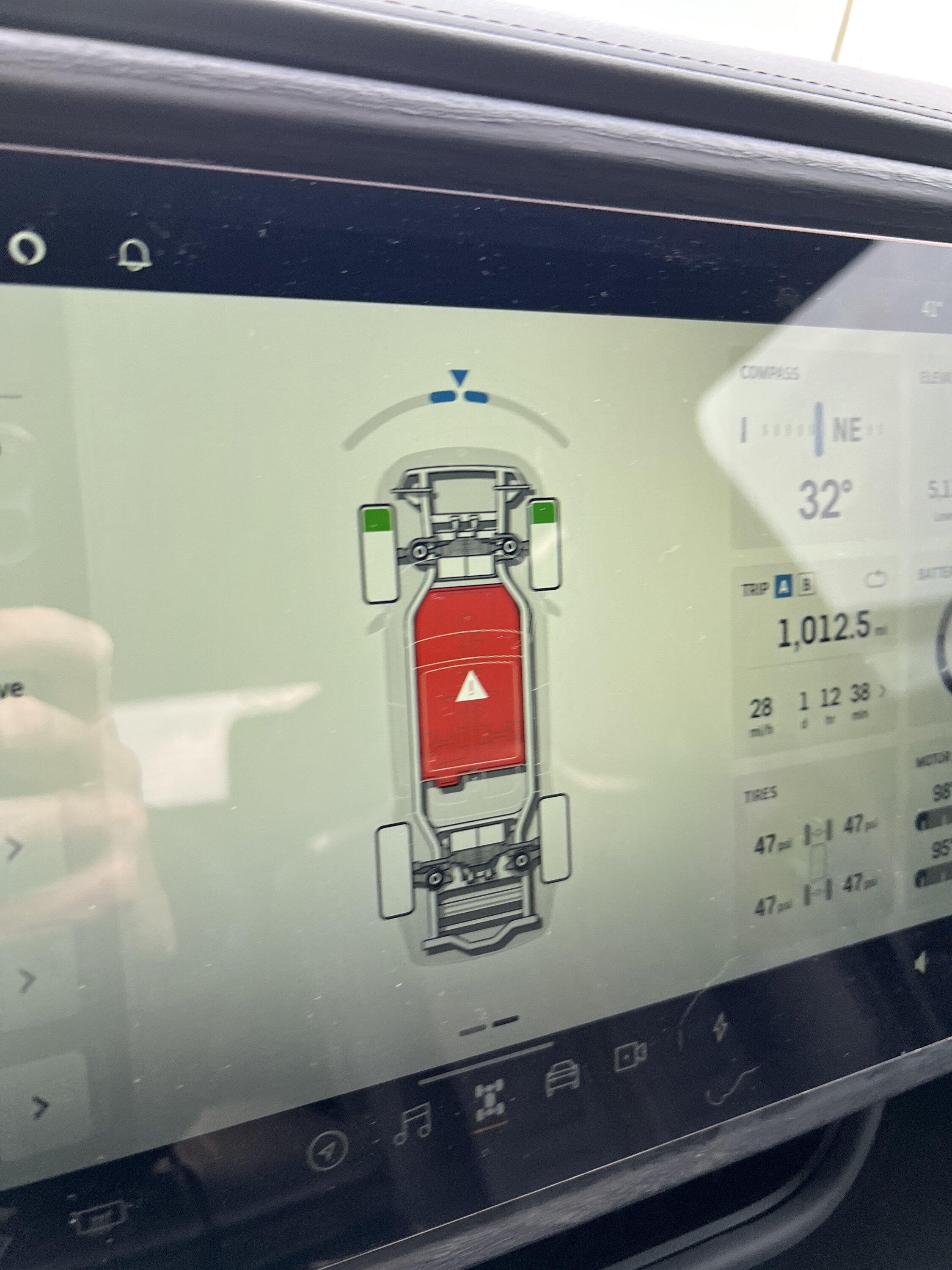 Rivian R1T R1S Infotainment/Driver Displays Black When in Park Warning.JPG