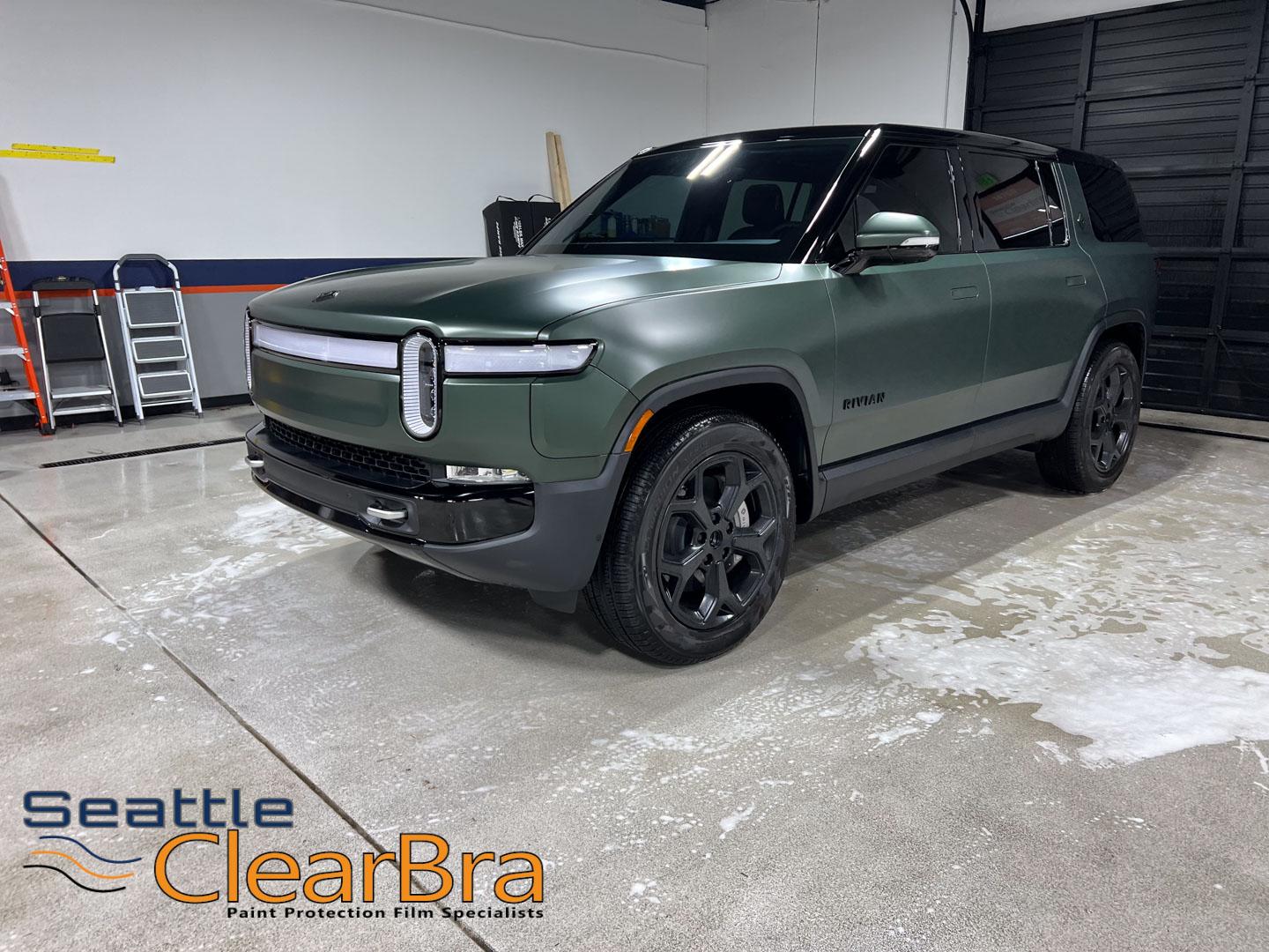 Rivian R1T R1S Transforming a Rivian: From Glossy to Stealth with Seattle ClearBra's Expertise rivian-ris-launch-green-xpel-stealth-clear-bra-ppf-pant-protection-film-seattle-clearbra-10