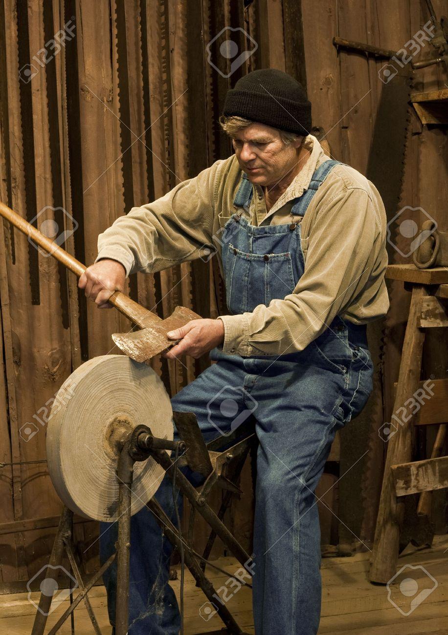 Rivian R1T R1S Rivian R1T first crash ? 7988817-man-sharpening-an-axe-on-an-old-pedal-powered-grinding-stone