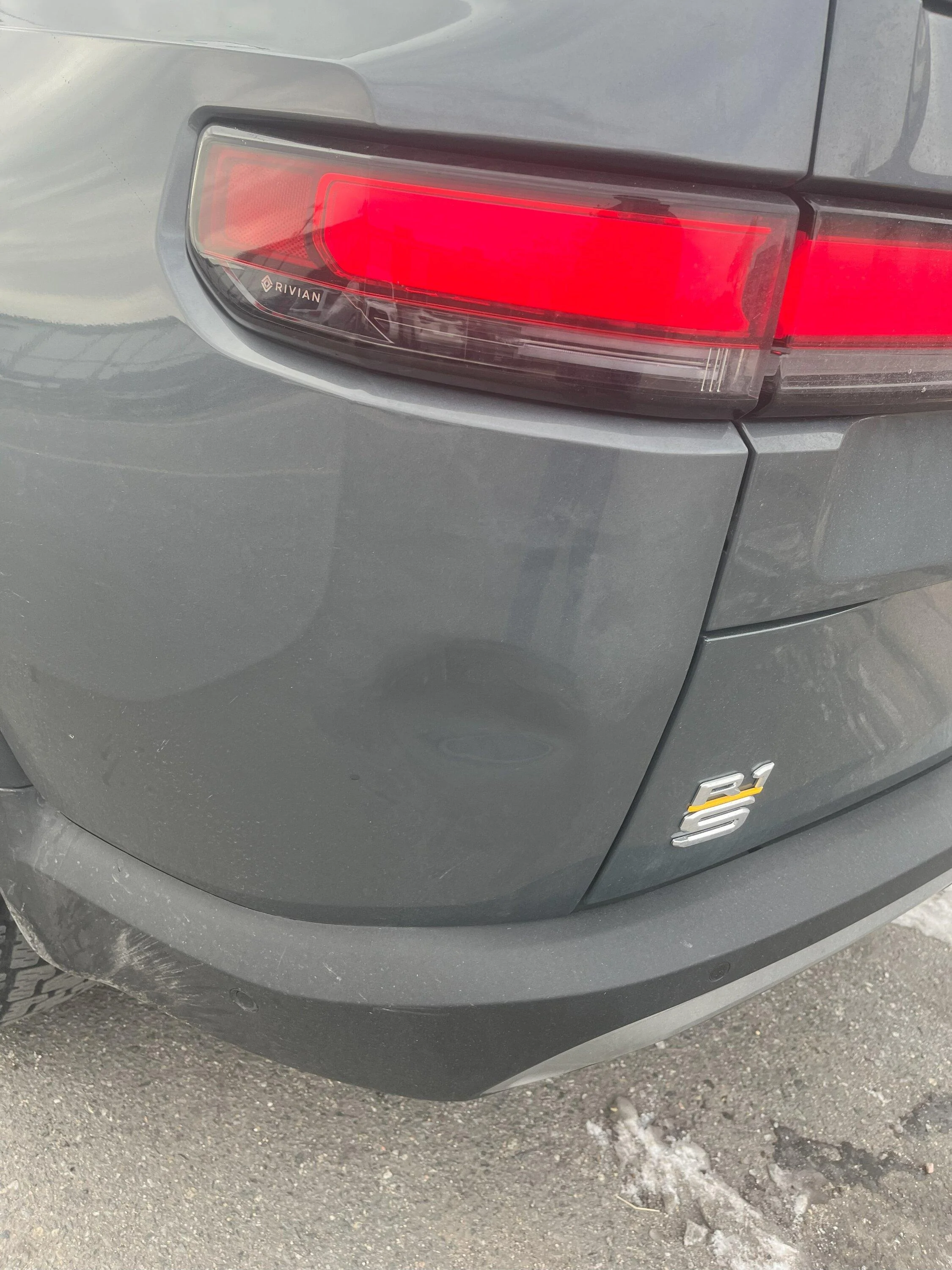Rivian R1T R1S First dent - any trouble accessing behind the quarter panel?  :( IMG_0452