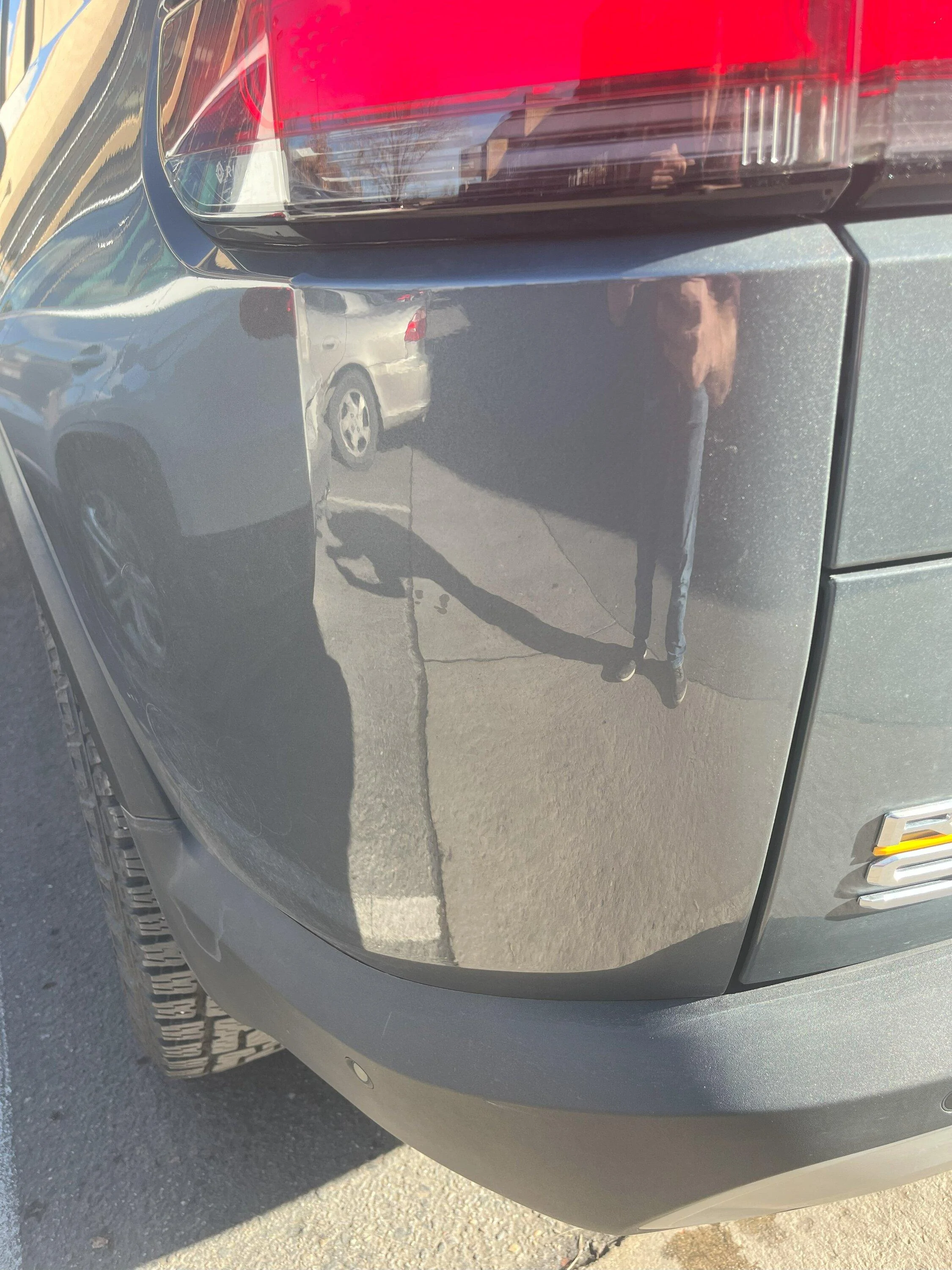 Rivian R1T R1S First dent - any trouble accessing behind the quarter panel?  :( IMG_0494