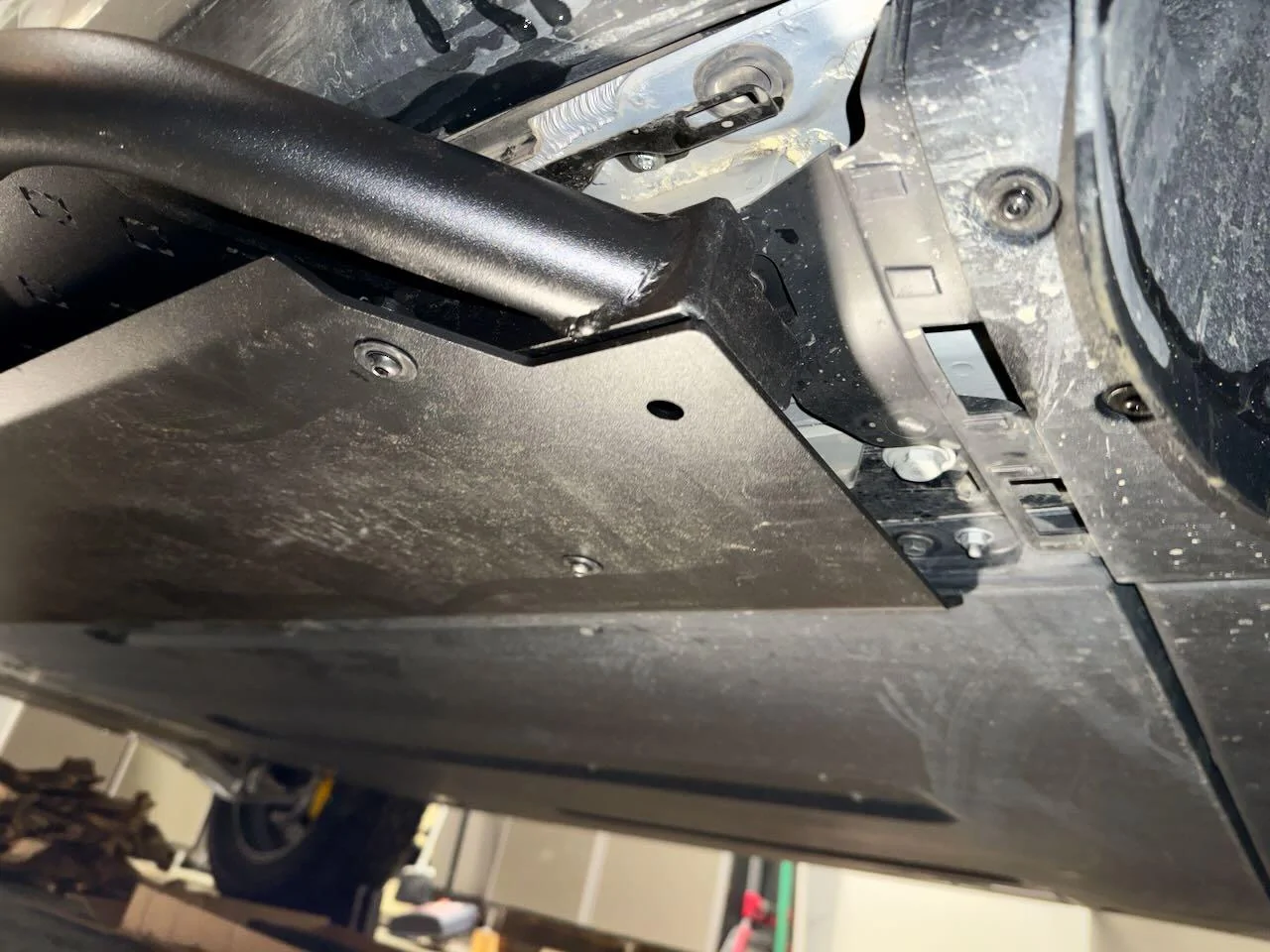 Rivian R1T R1S EVSportline Sliders - Cutting the panels 1b.RearOpen_lg