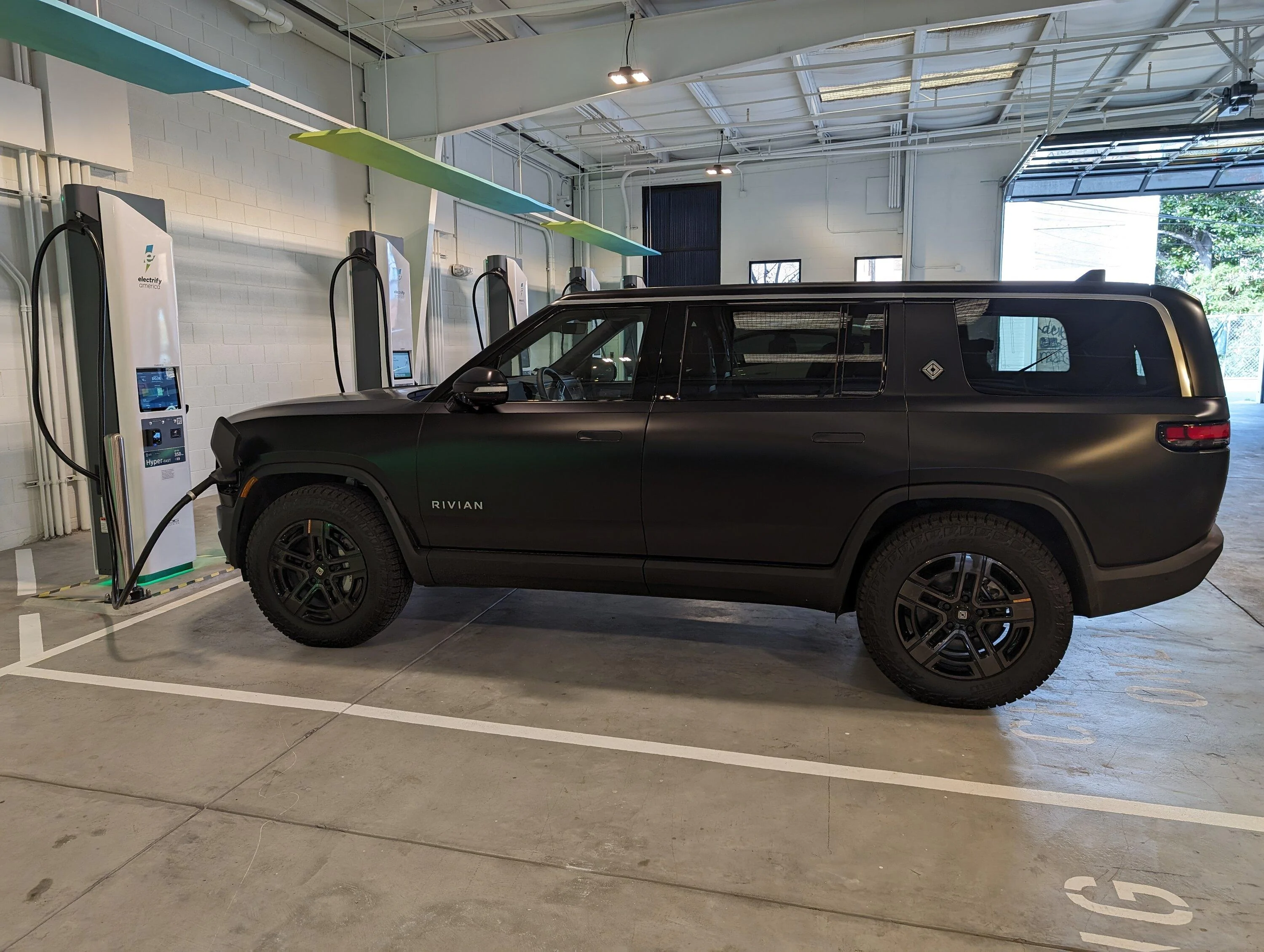 Rivian R1T R1S Electrify America unveils Indoor Flagship Charging Station (opened Feb 9, 2024) PXL_20240211_193741140.MP