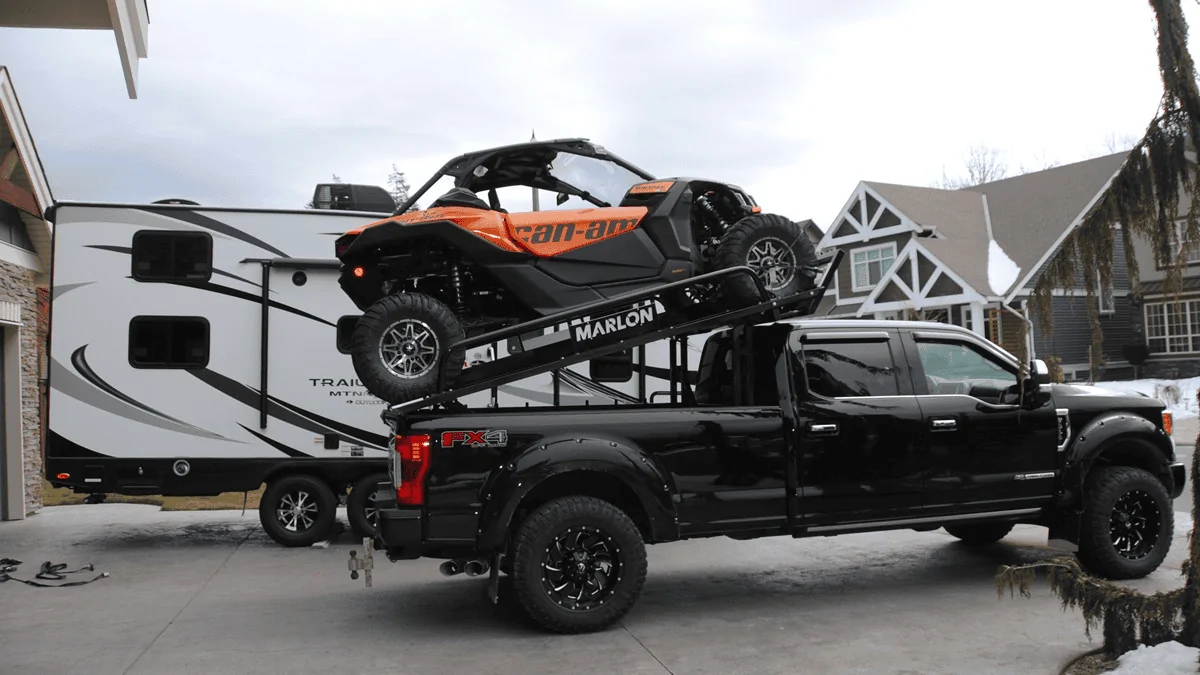 Rivian R1T R1S Snowmobile in R1T bed with deck / bed extender -- fits and performs well 1708971907753