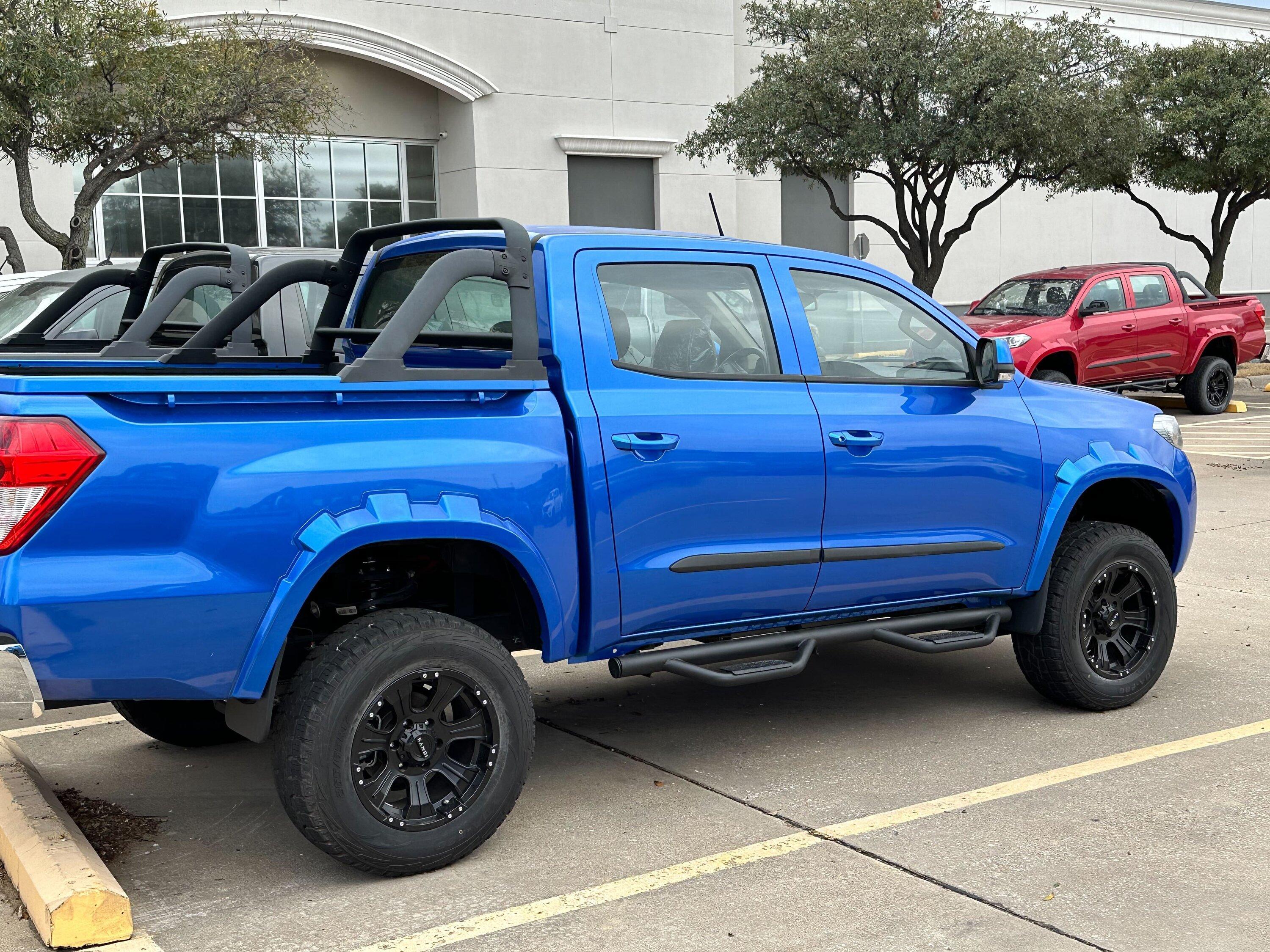 Rivian R1T R1S Found an entire parking lot full of Kandi K32 Pickups Image from iOS (1)