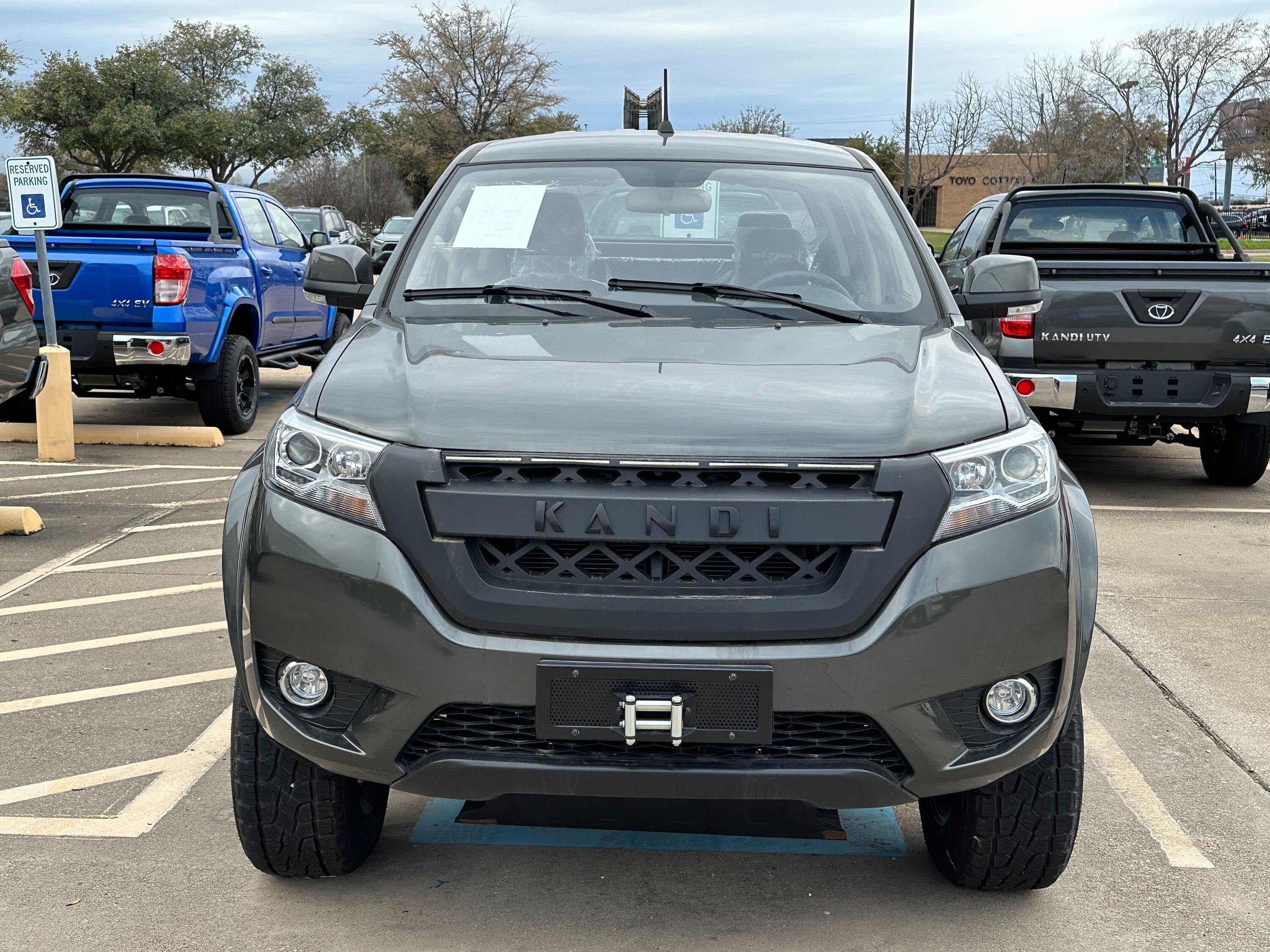 Rivian R1T R1S Found an entire parking lot full of Kandi K32 Pickups Image from iOS