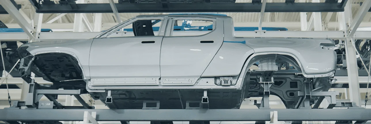 Rivian R1T R1S A "Play by Play Illustrated Commentary" why R2 production would be challenging to retrofit into existing R1 or EDV line 1710089676874