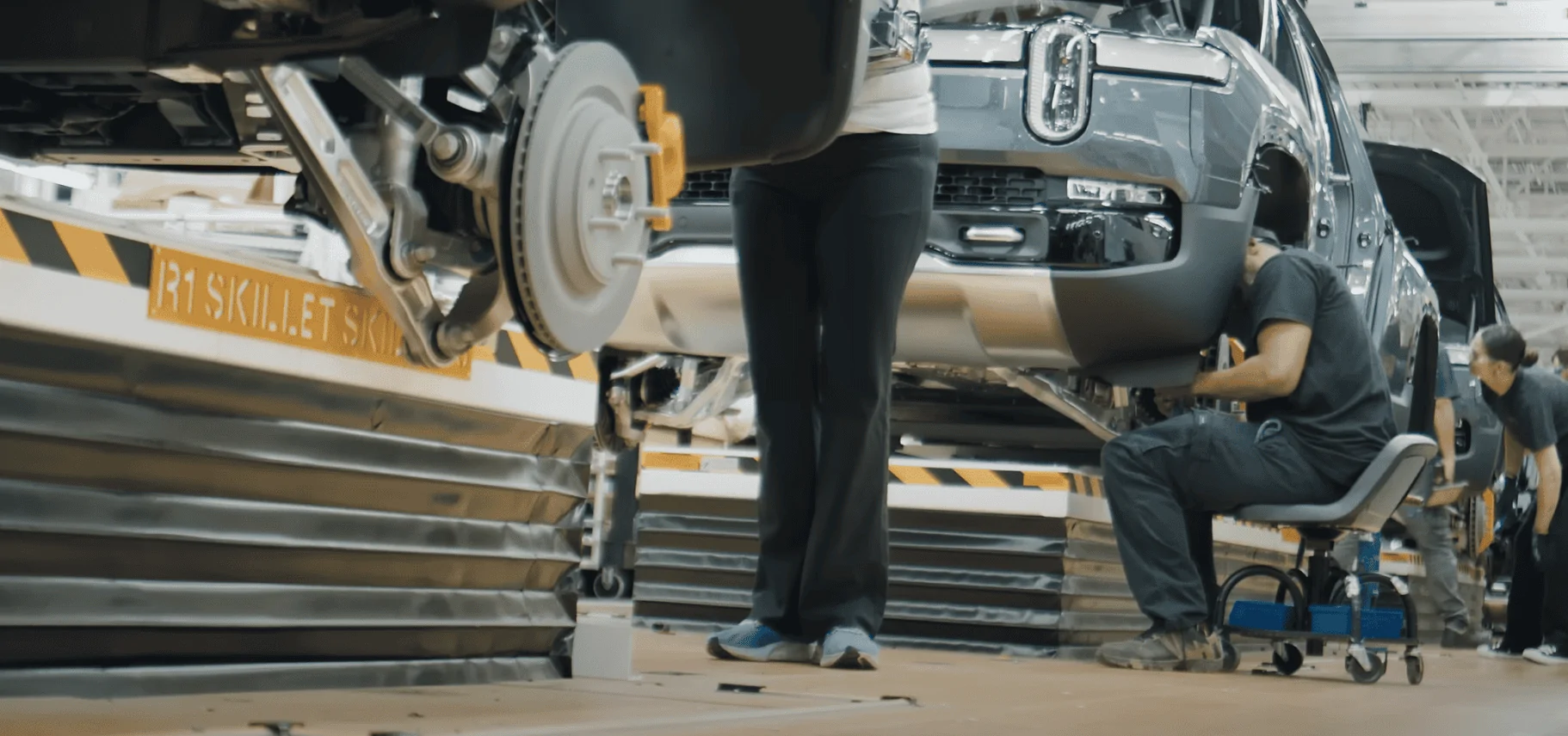 Rivian R1T R1S A "Play by Play Illustrated Commentary" why R2 production would be challenging to retrofit into existing R1 or EDV line 1710089797696