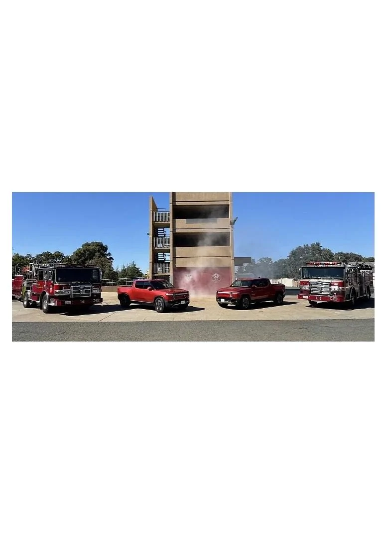 Rivian R1T R1S Rivian sightings on random media (post yours) Two Red Rivians