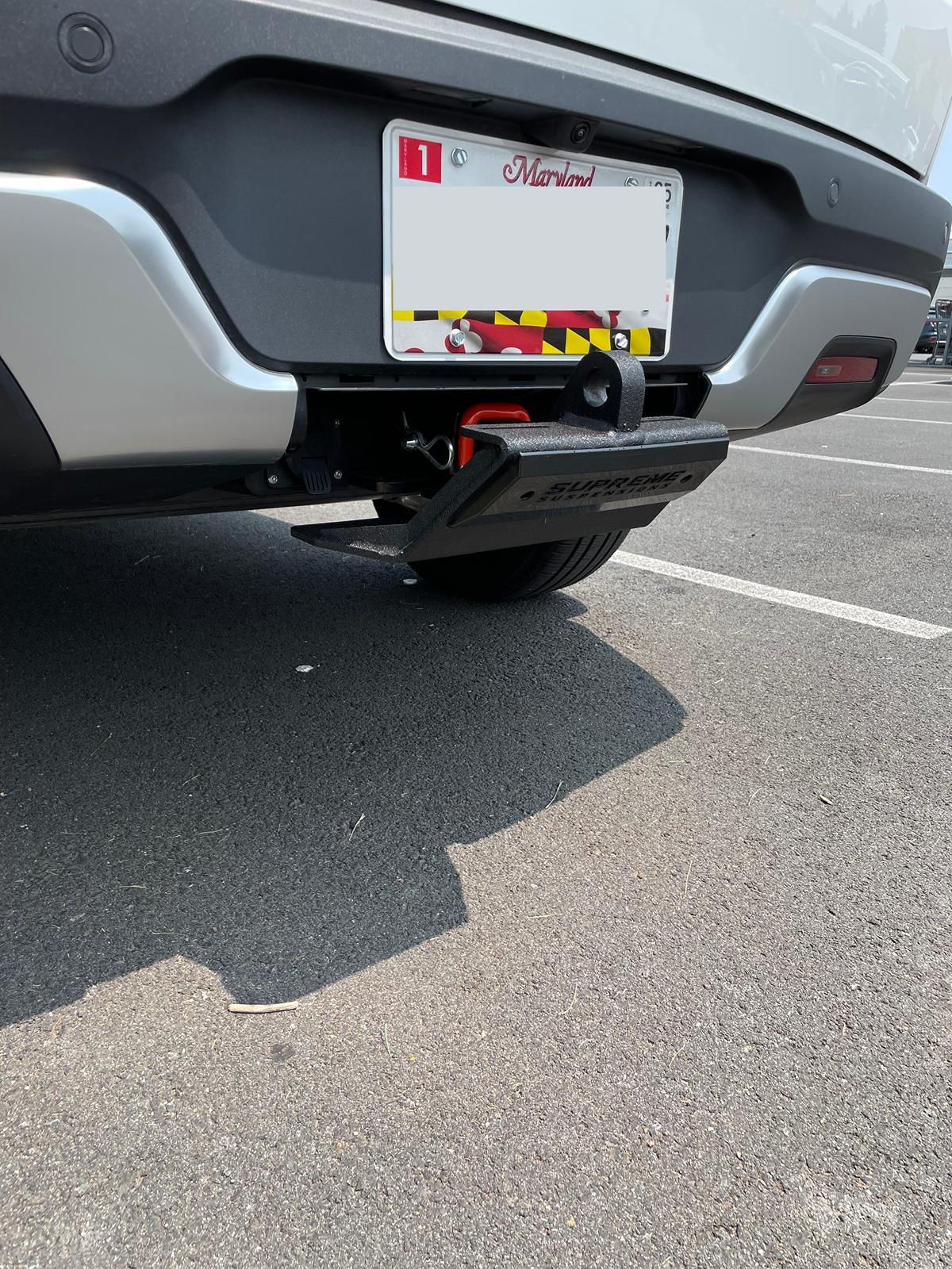 Rivian R1T R1S Hitch Step / rear skid plate installed Rivian rear hitch