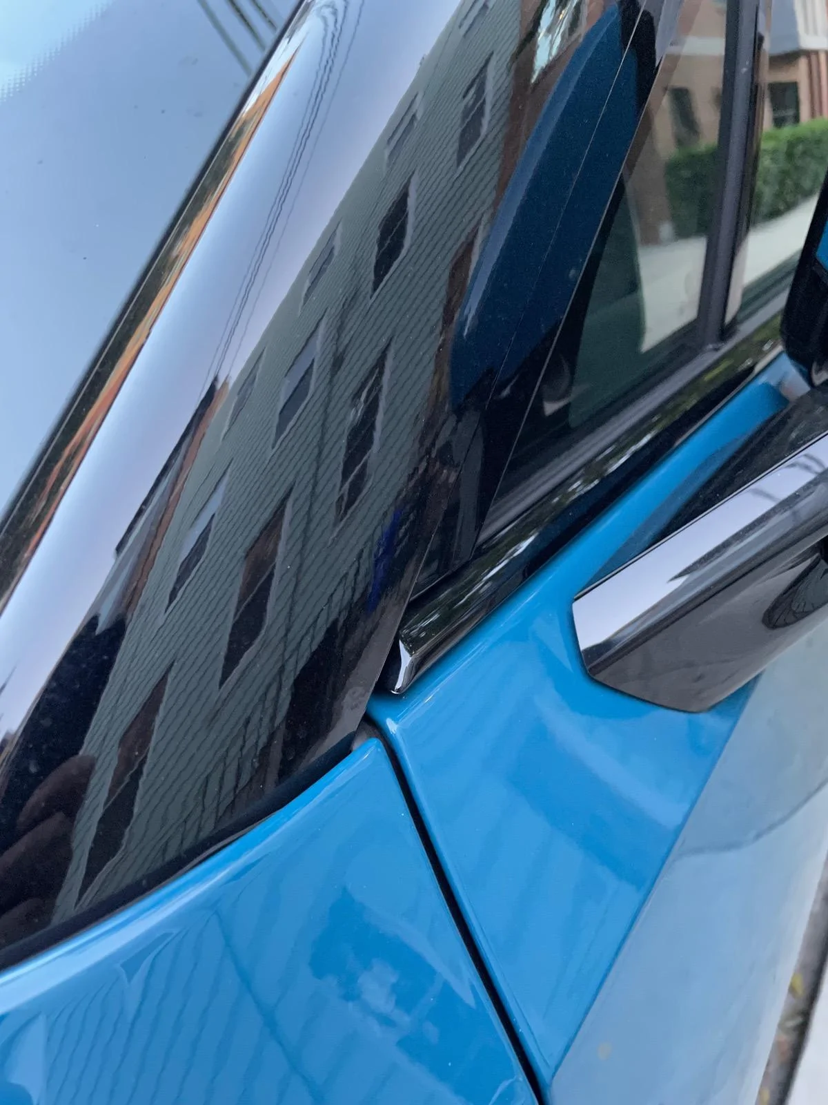 Rivian R1T R1S Resolved (my) excessive wind noise 2023 R1T (cause: corner window plastic trim) IMG_6001