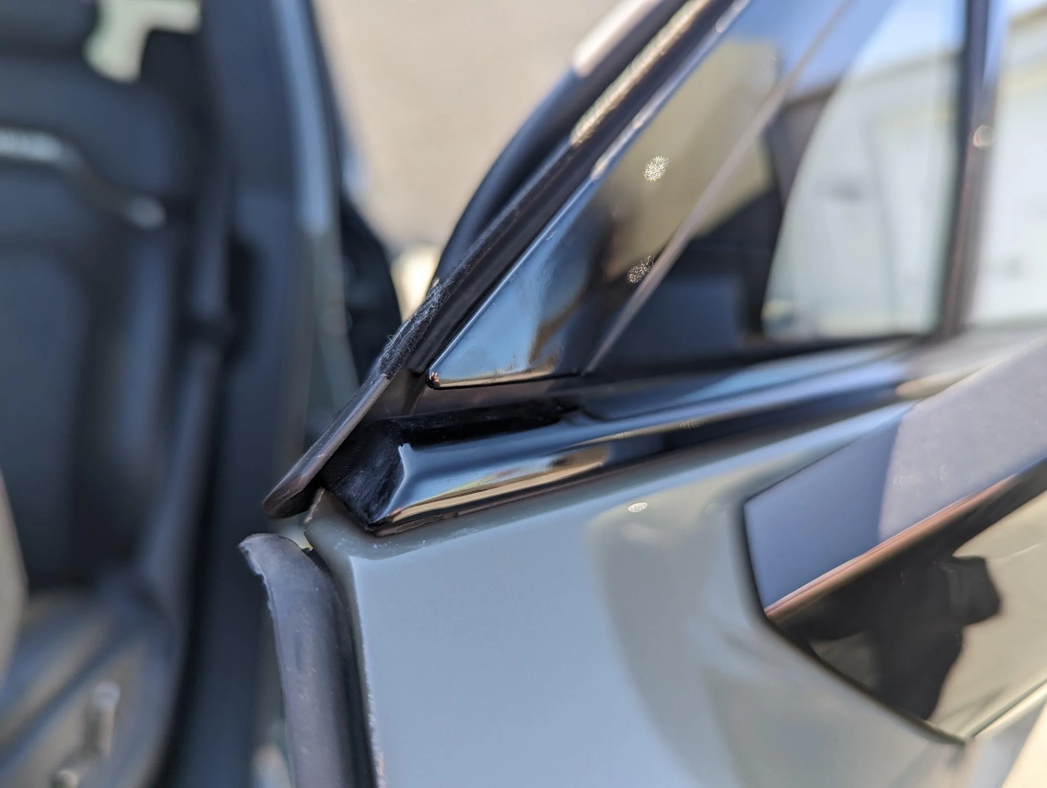Rivian R1T R1S Resolved (my) excessive wind noise 2023 R1T (cause: corner window plastic trim) PXL_20240324_184608203